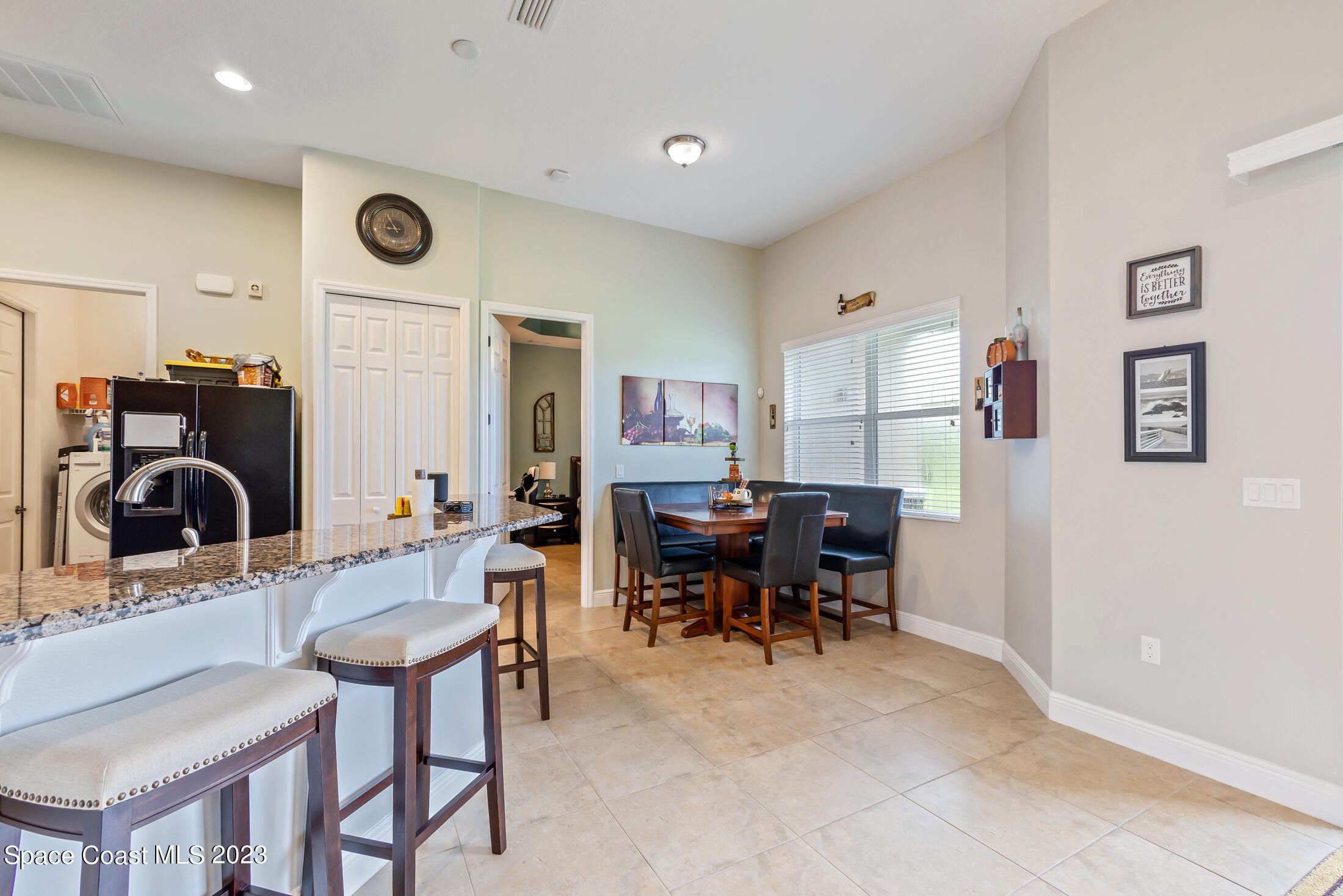 1840 Trimble Road Melbourne, FL 32934 - Photo 15 of 42 a living room with furniture a clock and a window