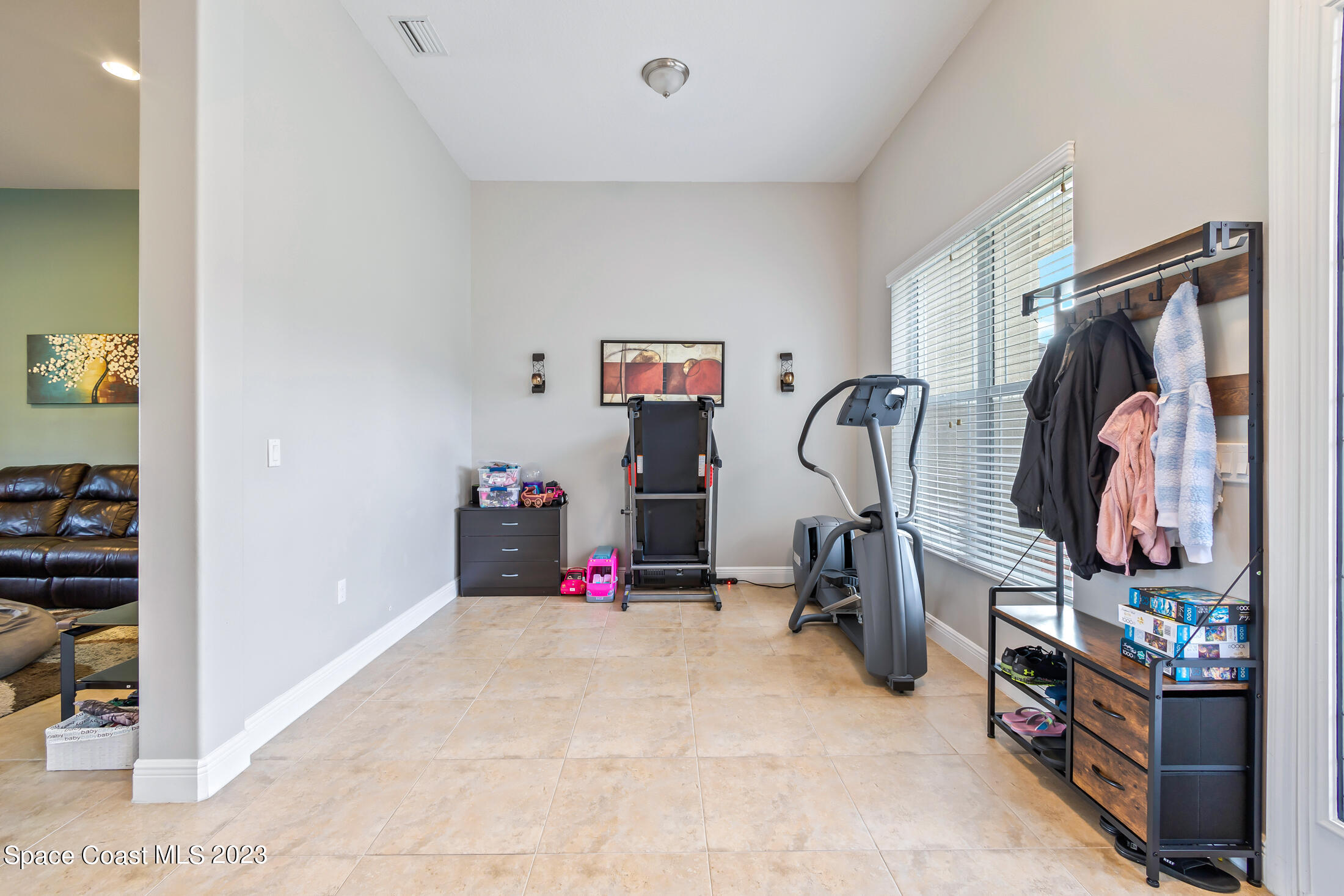1840 Trimble Road Melbourne, FL 32934 - Photo 17 of 42 a view of a room with gym equipment