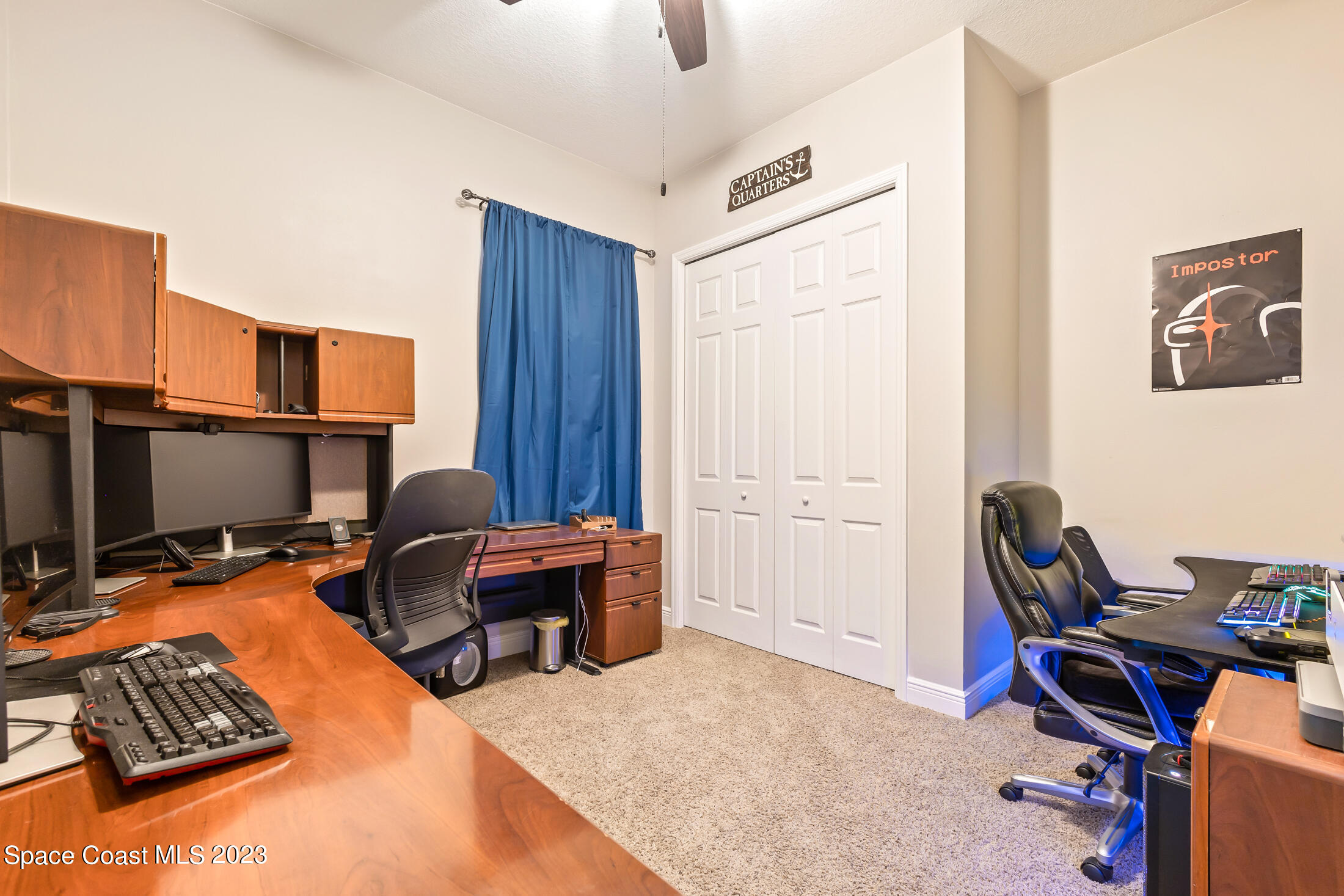 1840 Trimble Road Melbourne, FL 32934 - Photo 27 of 42 a view of a workspace with furniture and a window