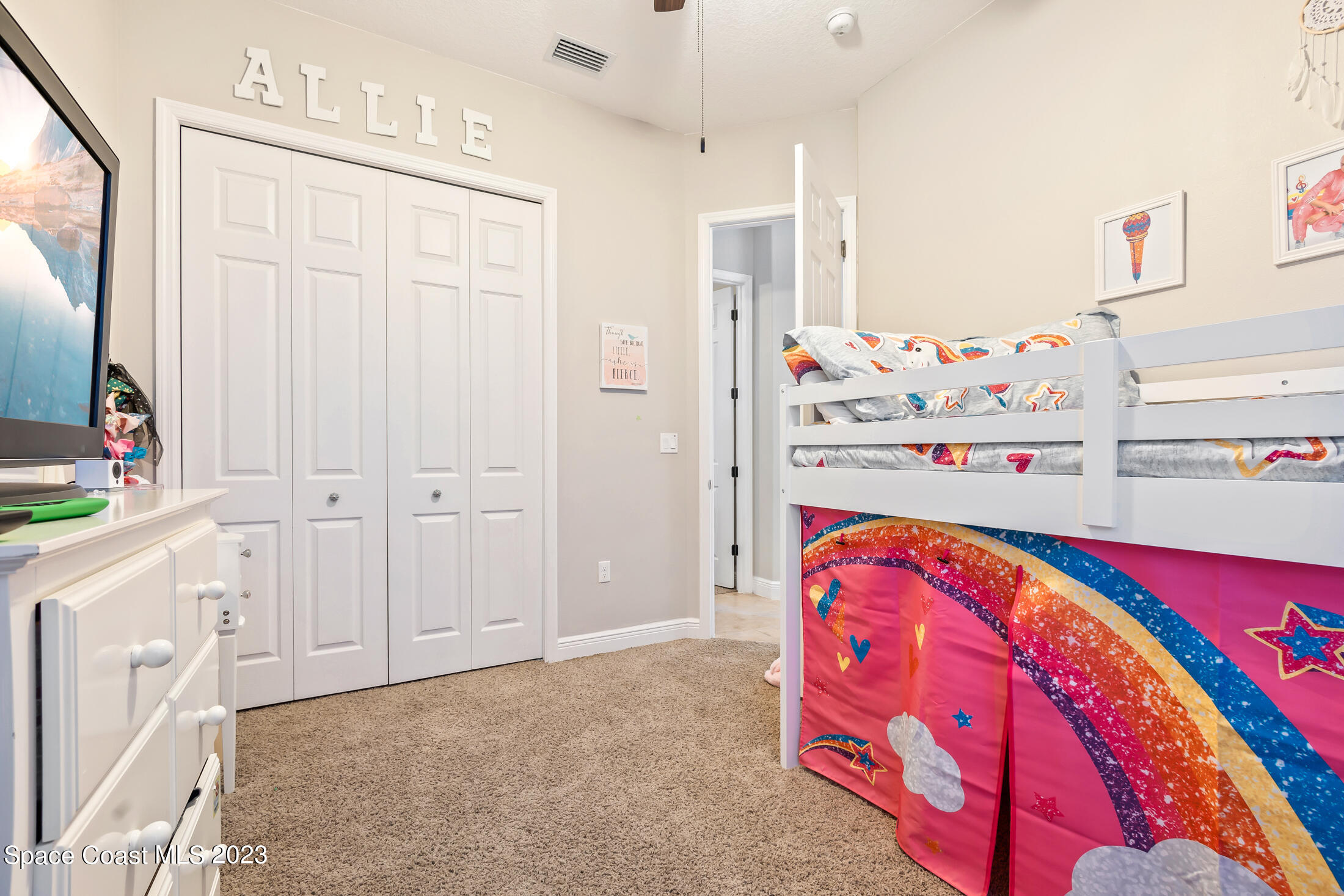 1840 Trimble Road Melbourne, FL 32934 - Photo 32 of 42 a view of walk in closet with clothes and shoes