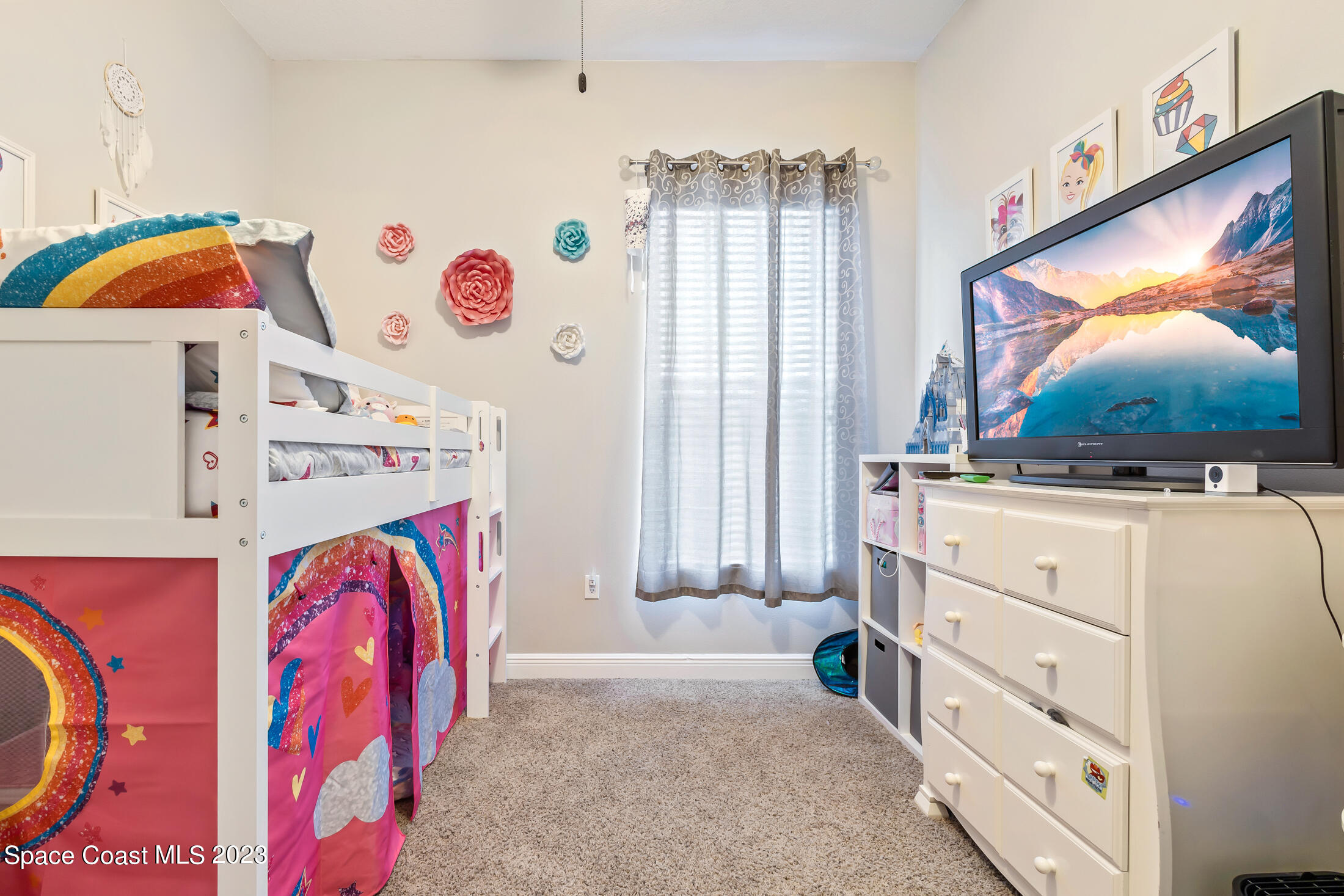1840 Trimble Road Melbourne, FL 32934 - Photo 33 of 42 a view of walk in closet with clothes and shoes