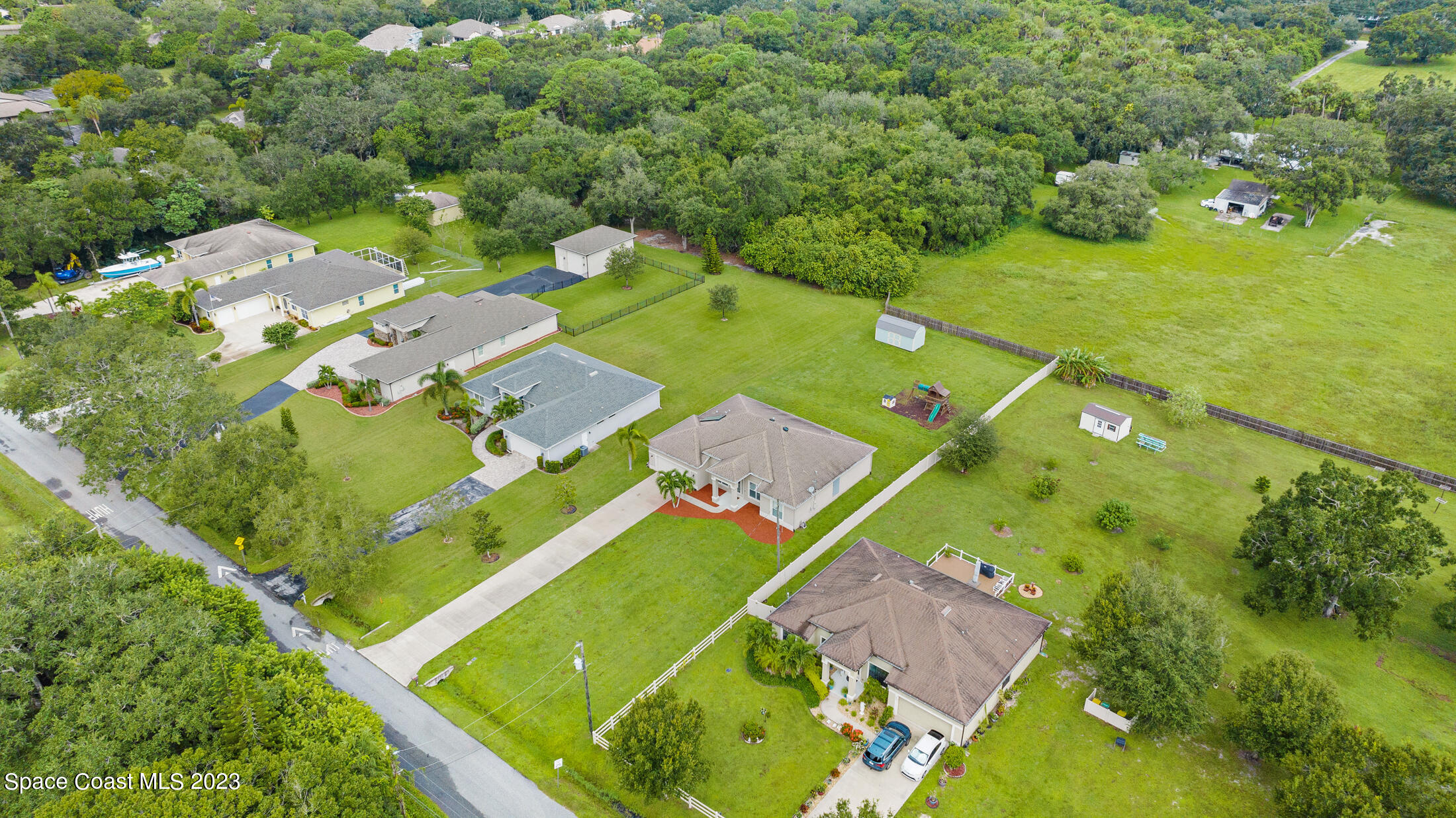 1840 Trimble Road Melbourne, FL 32934 - Photo 36 of 42 an aerial view of a pool yard residential house and outdoor space