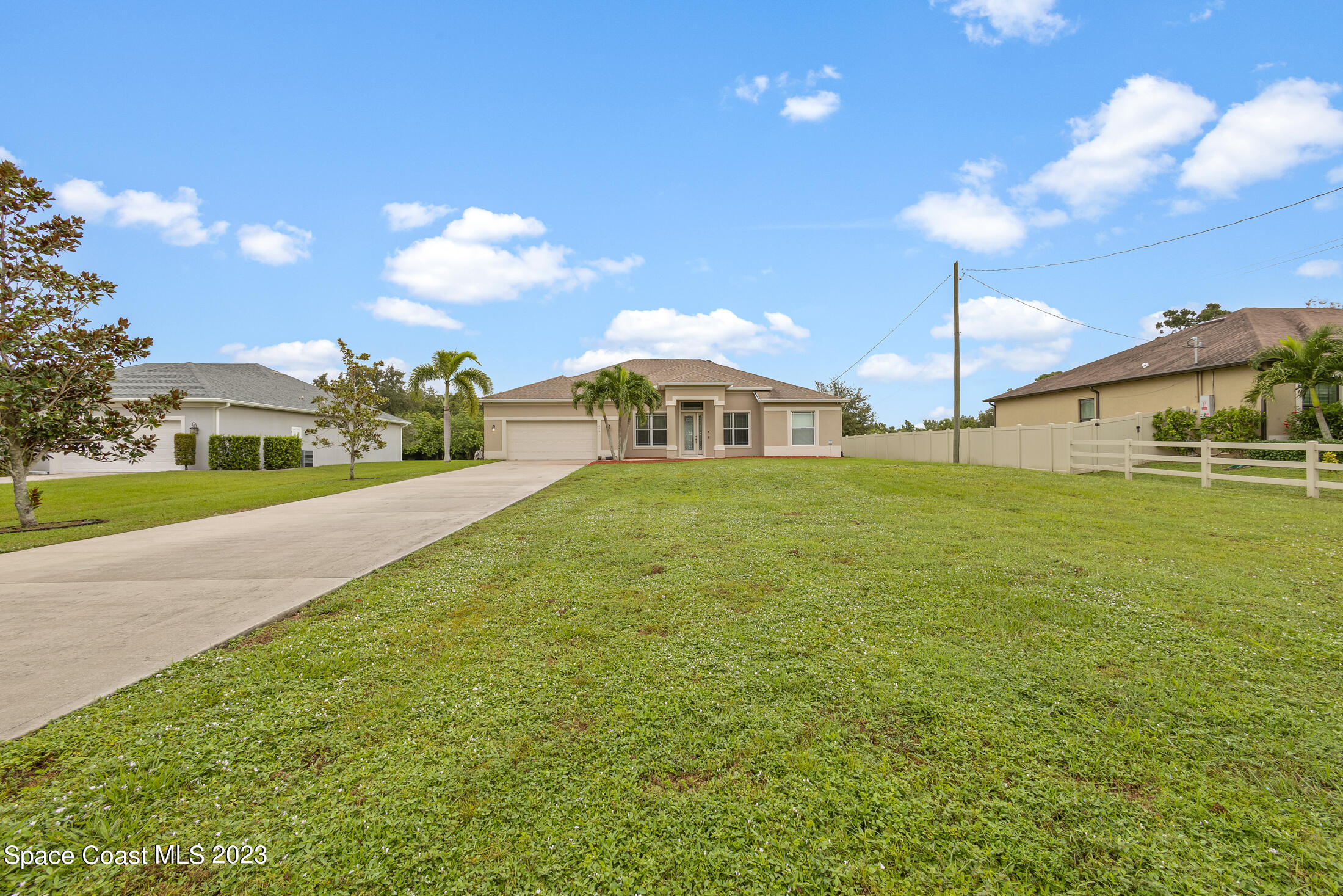 1840 Trimble Road Melbourne, FL 32934 - Photo 4 of 42 a large yard with table and chairs