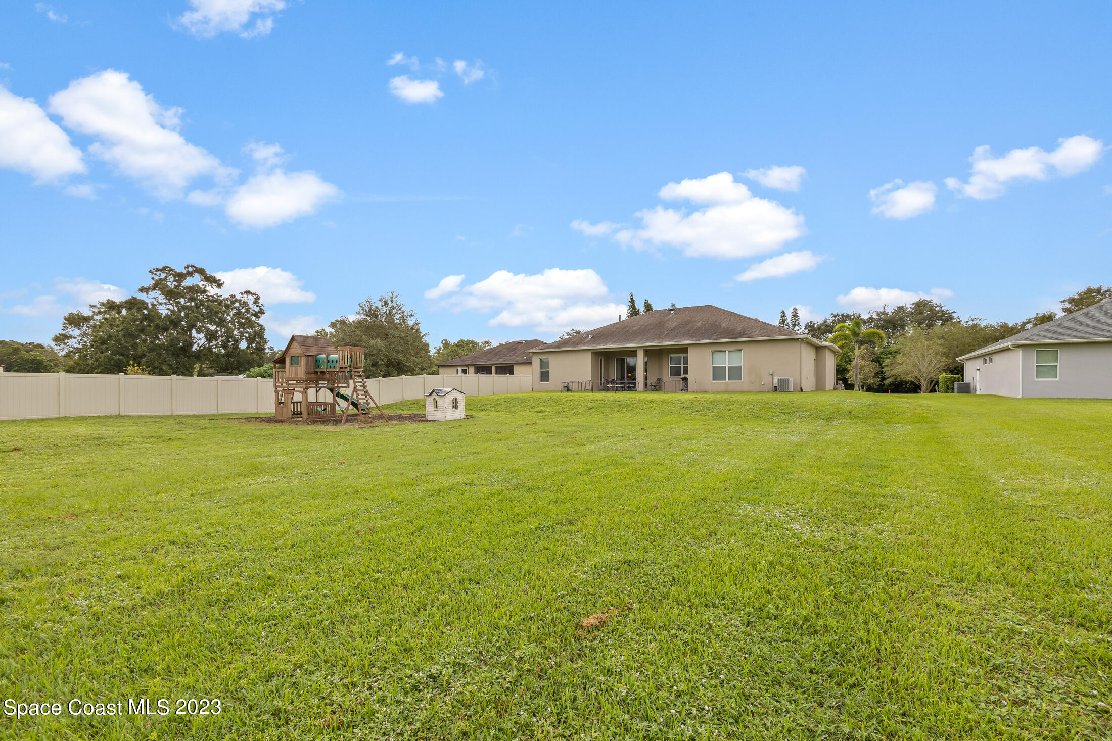 1840 Trimble Road Melbourne, FL 32934 - Photo 5 of 42 a view of an house with backyard and garden