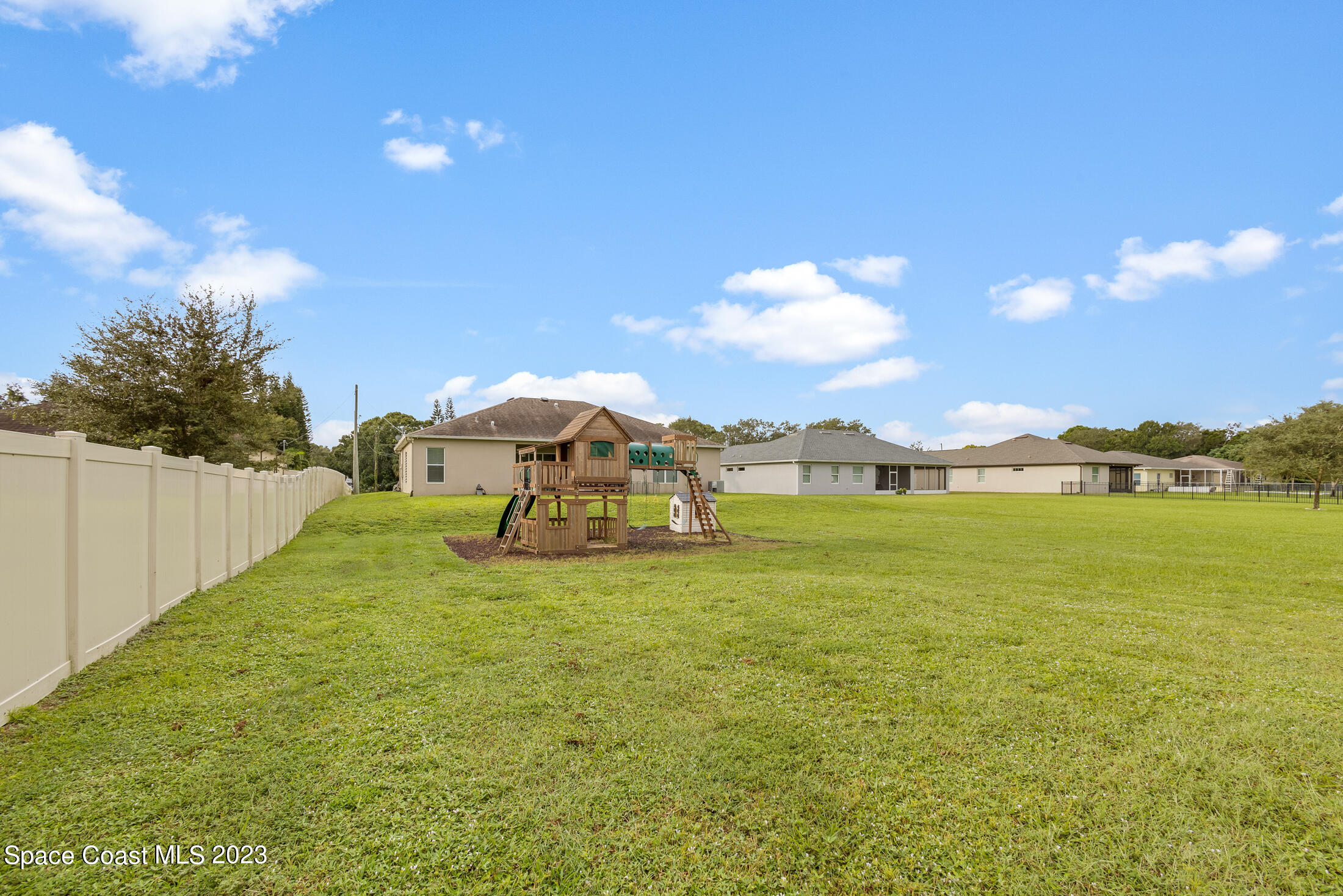 1840 Trimble Road Melbourne, FL 32934 - Photo 7 of 42 a view of a lake with houses in the back