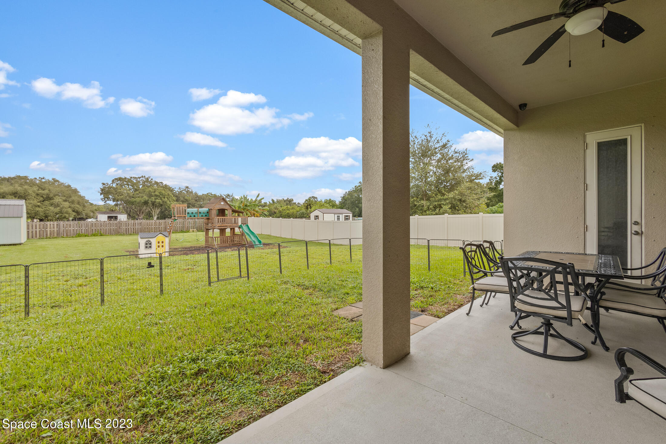 1840 Trimble Road Melbourne, FL 32934 - Photo 8 of 42 a view of a garden with lawn chairs