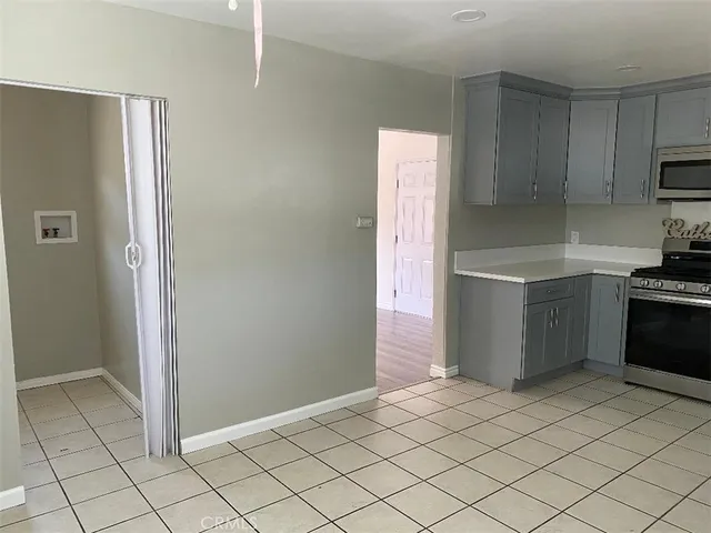 a kitchen with stainless steel appliances a refrigerator and a stove