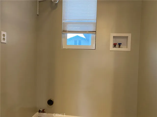 a view of a bathroom that has a window