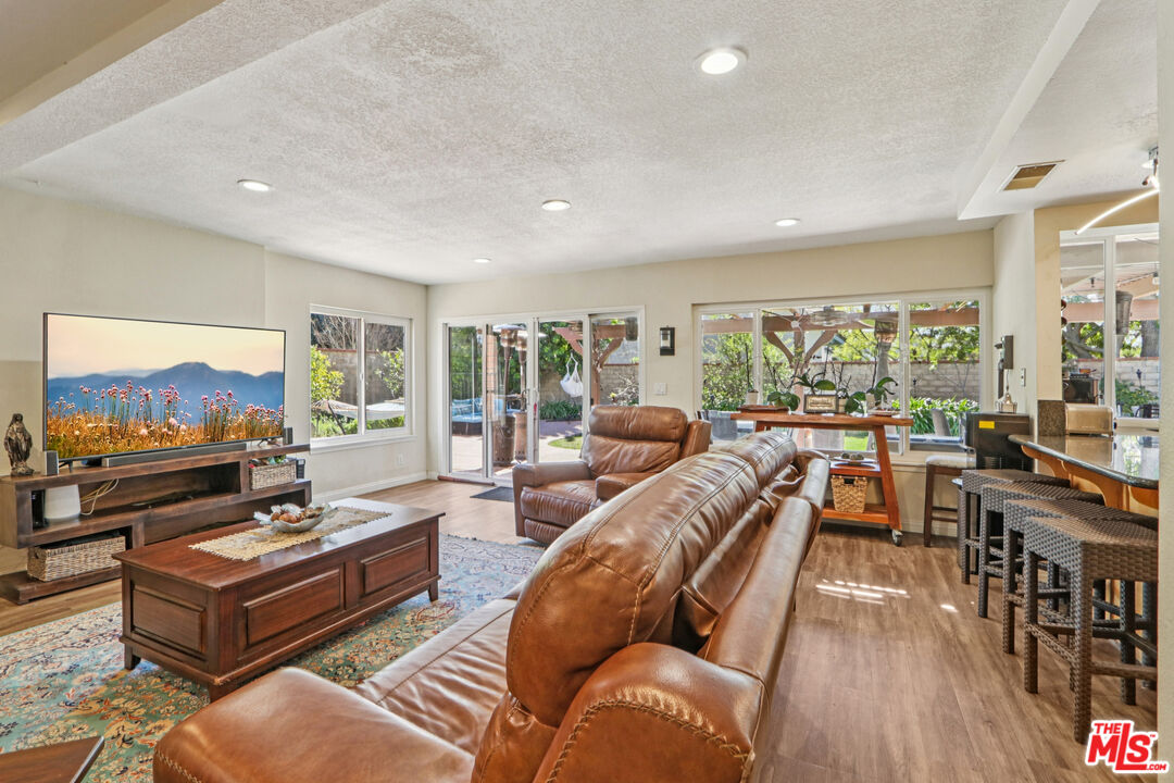 2136 McCrea Road Thousand Oaks, CA 91362 - Photo 28 of 66 a living room with furniture and a flat screen tv