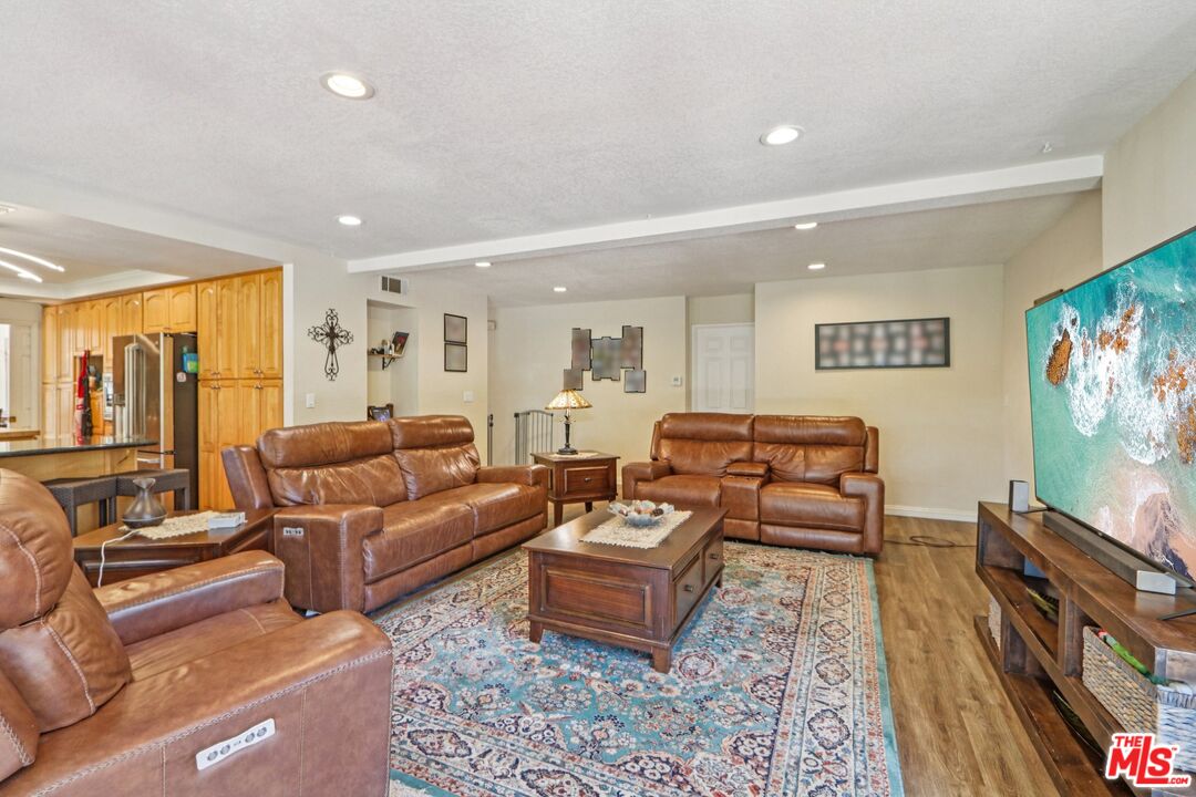2136 McCrea Road Thousand Oaks, CA 91362 - Photo 29 of 66 a living room with furniture and a flat screen tv