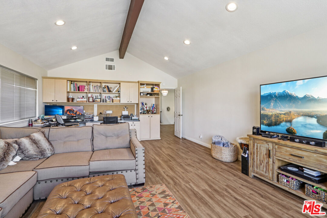 2136 McCrea Road Thousand Oaks, CA 91362 - Photo 64 of 66 a living room with furniture and a flat screen tv