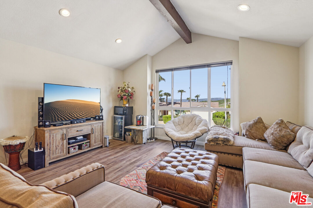 2136 McCrea Road Thousand Oaks, CA 91362 - Photo 65 of 66 a living room with furniture and a flat screen tv