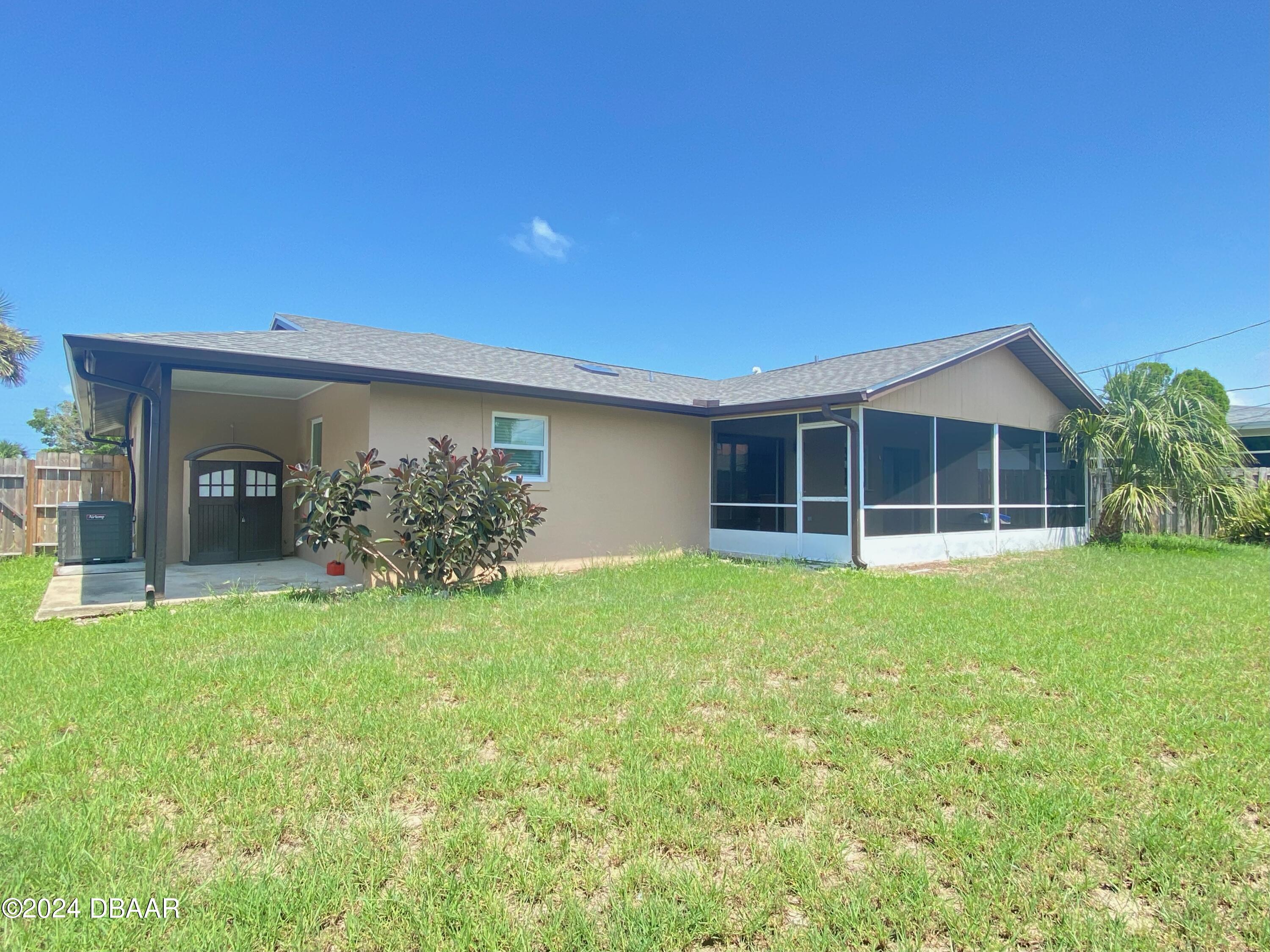 12 Ocean Crest Drive Ormond Beach, FL 32176 - Photo 11 of 31 a view of a house with backyard and porch