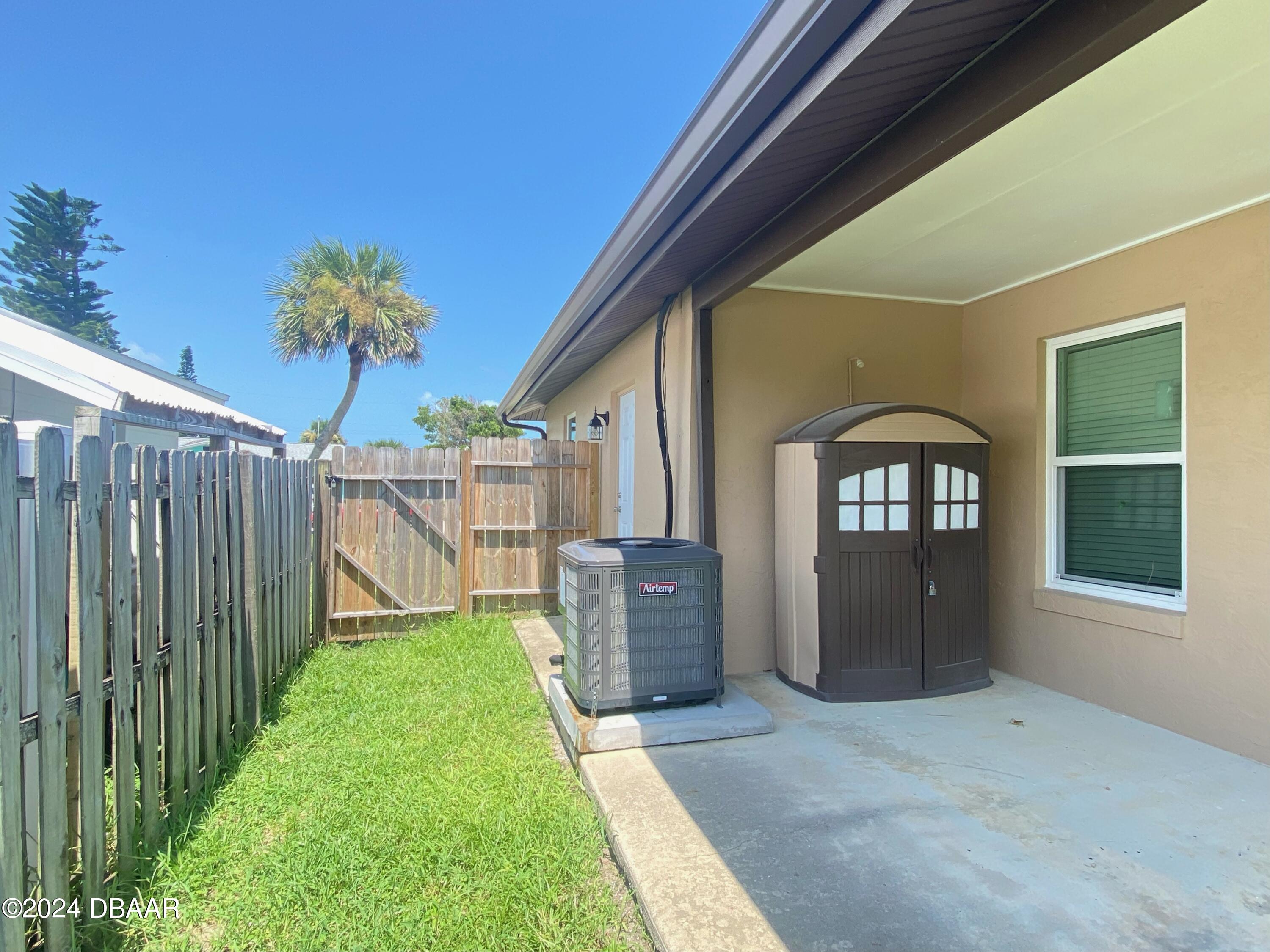 12 Ocean Crest Drive Ormond Beach, FL 32176 - Photo 12 of 31 a front view of a house with a yard