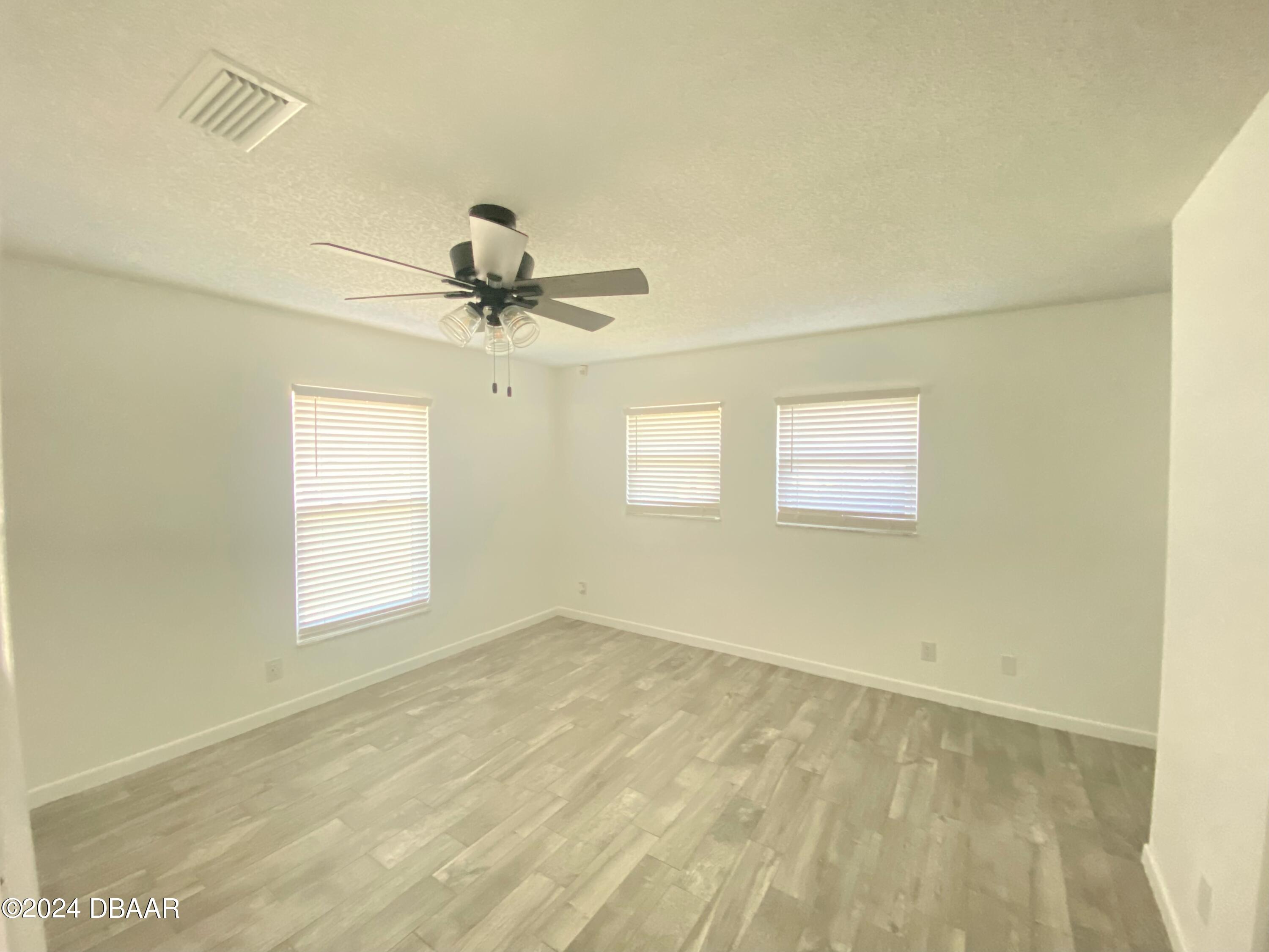 12 Ocean Crest Drive Ormond Beach, FL 32176 - Photo 13 of 31 a view of a room with a window and a ceiling fan