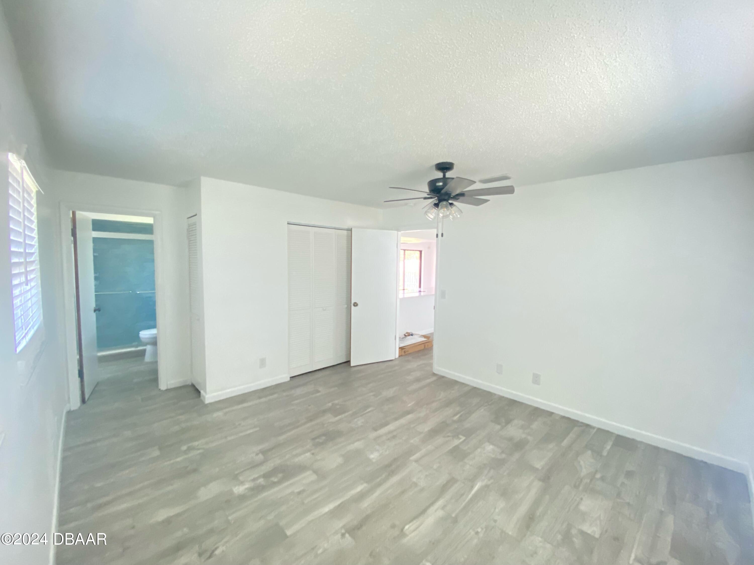 12 Ocean Crest Drive Ormond Beach, FL 32176 - Photo 15 of 31 an empty room with a bathroom