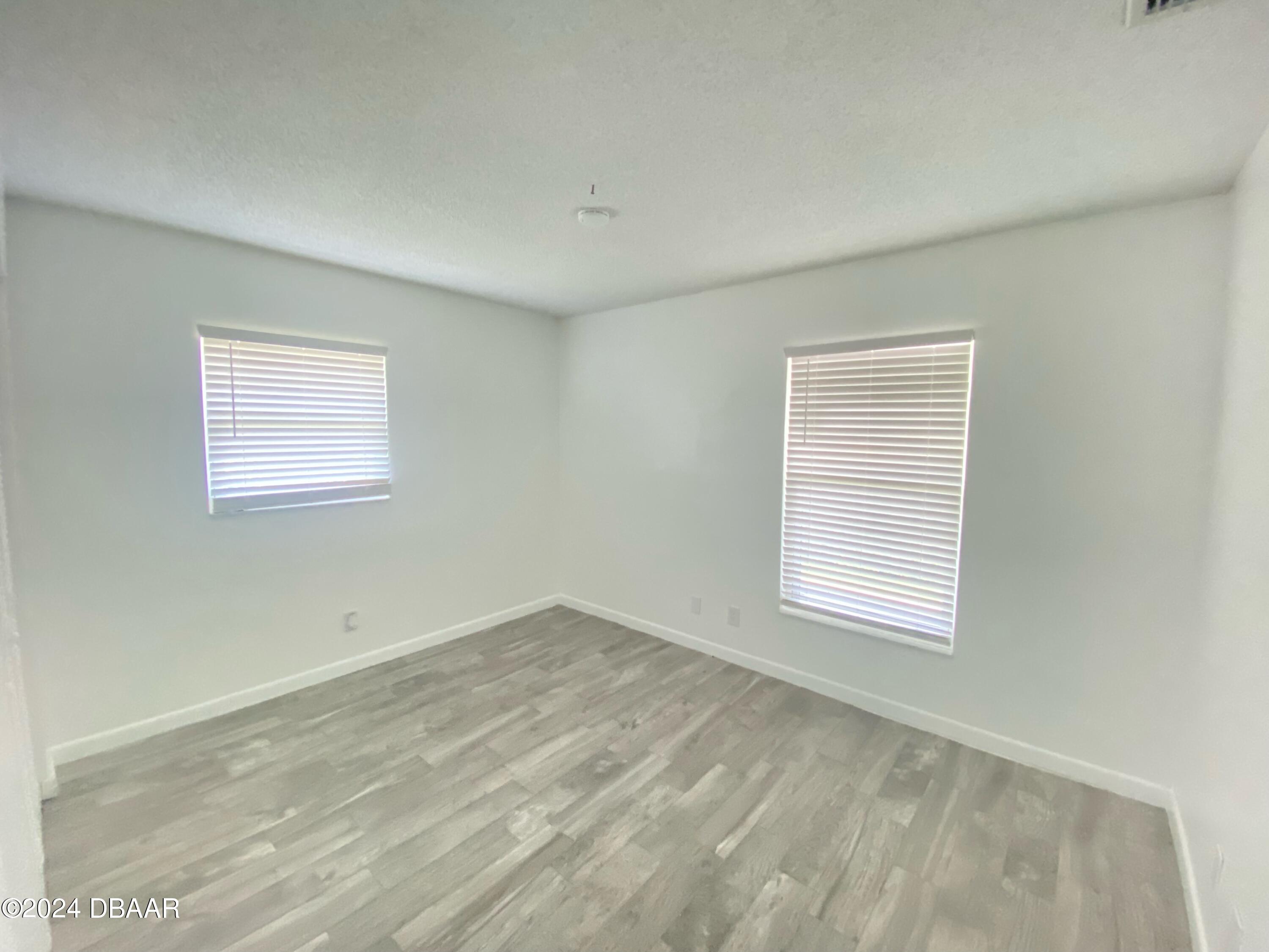 12 Ocean Crest Drive Ormond Beach, FL 32176 - Photo 17 of 31 an empty room with a window