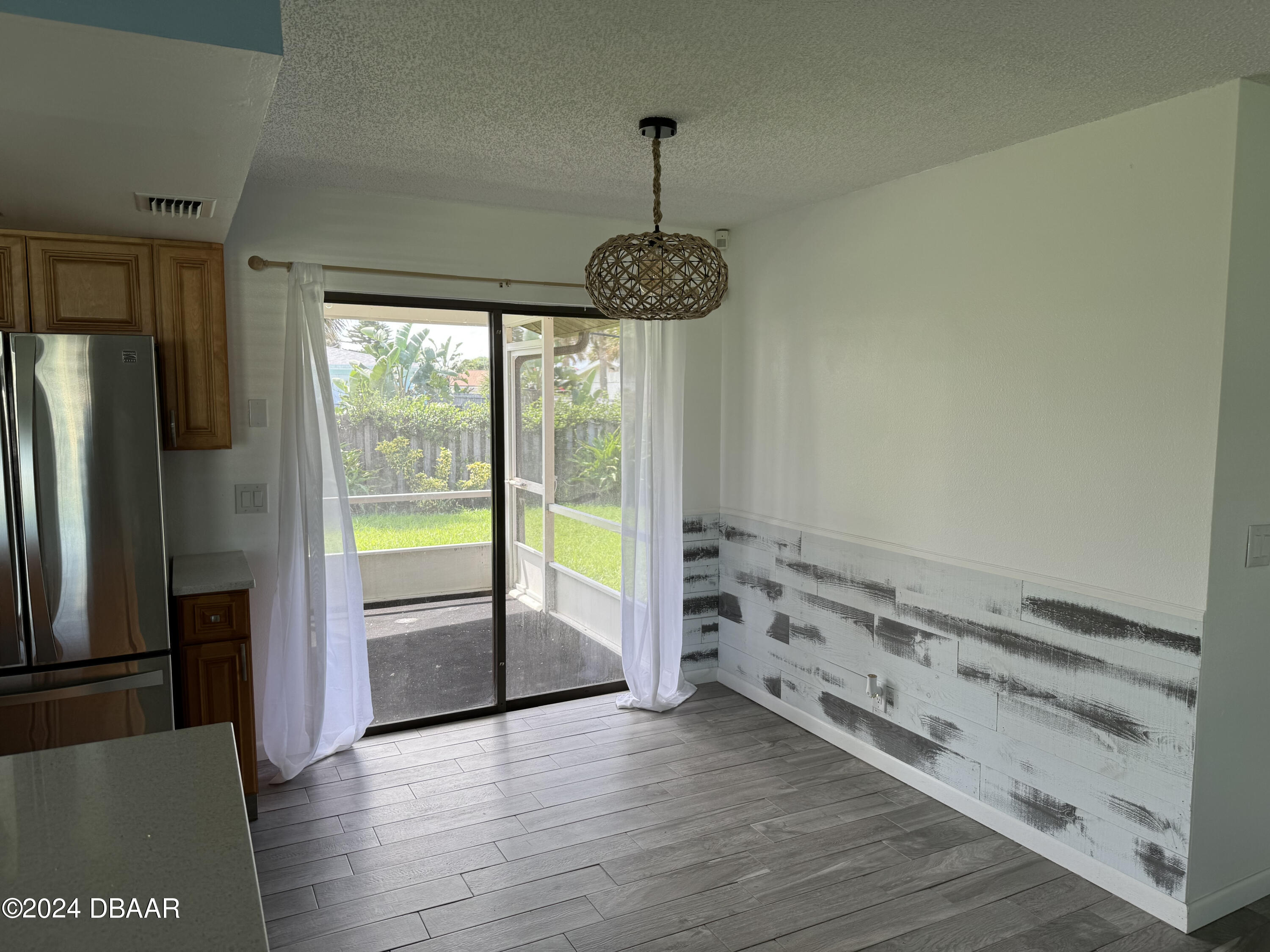 12 Ocean Crest Drive Ormond Beach, FL 32176 - Photo 21 of 31 a room with hard wood floors and a window