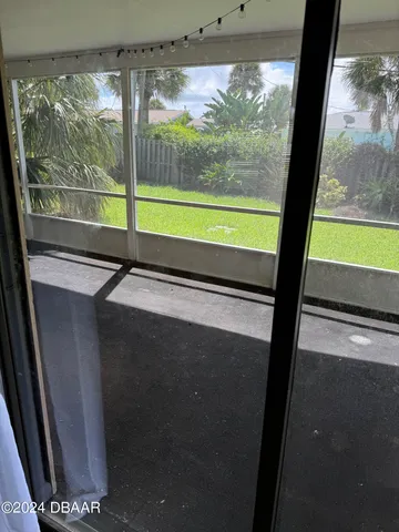 a view of a room with a large window