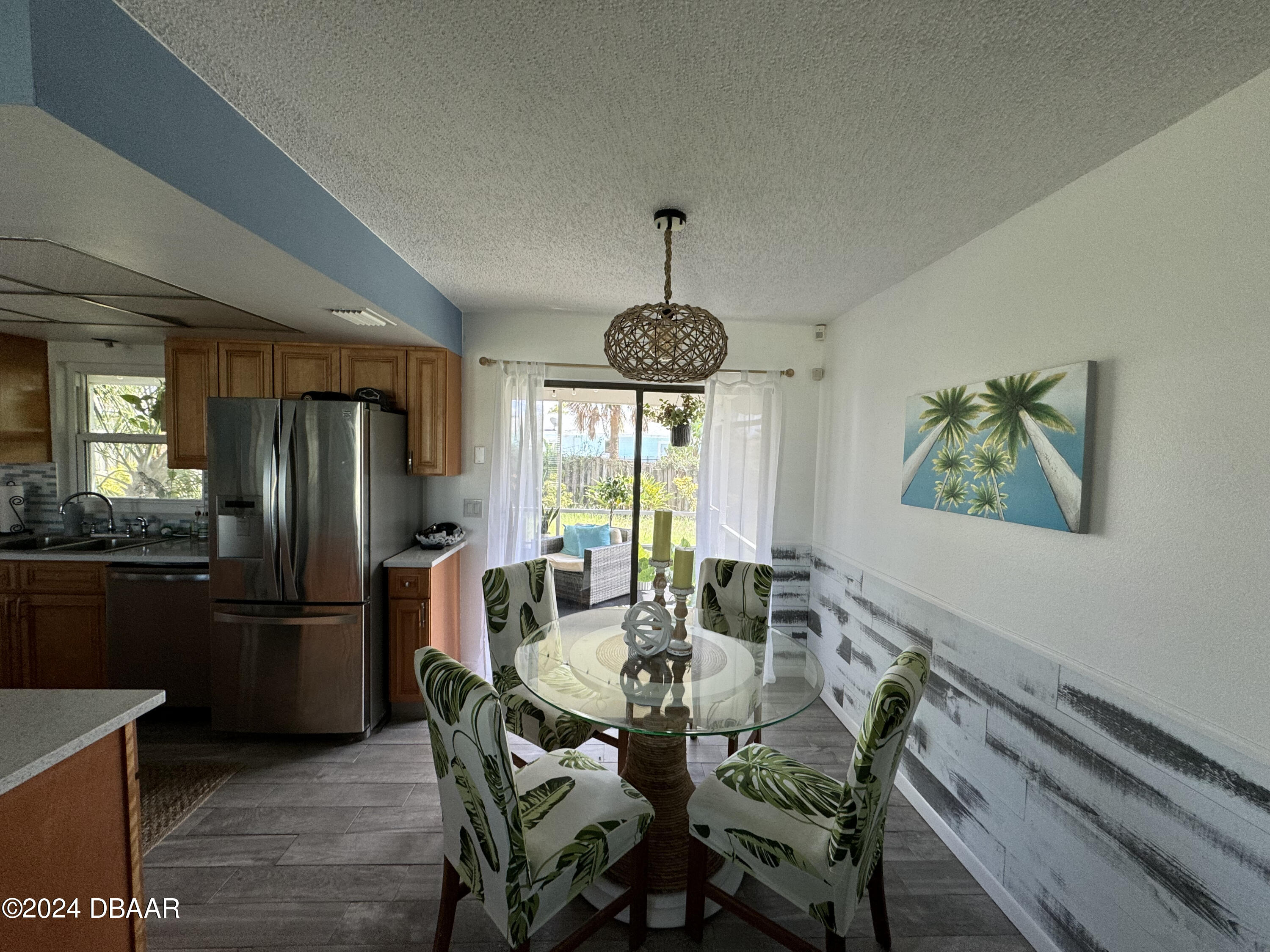 12 Ocean Crest Drive Ormond Beach, FL 32176 - Photo 25 of 31 a view of a dining room with furniture window and outside view