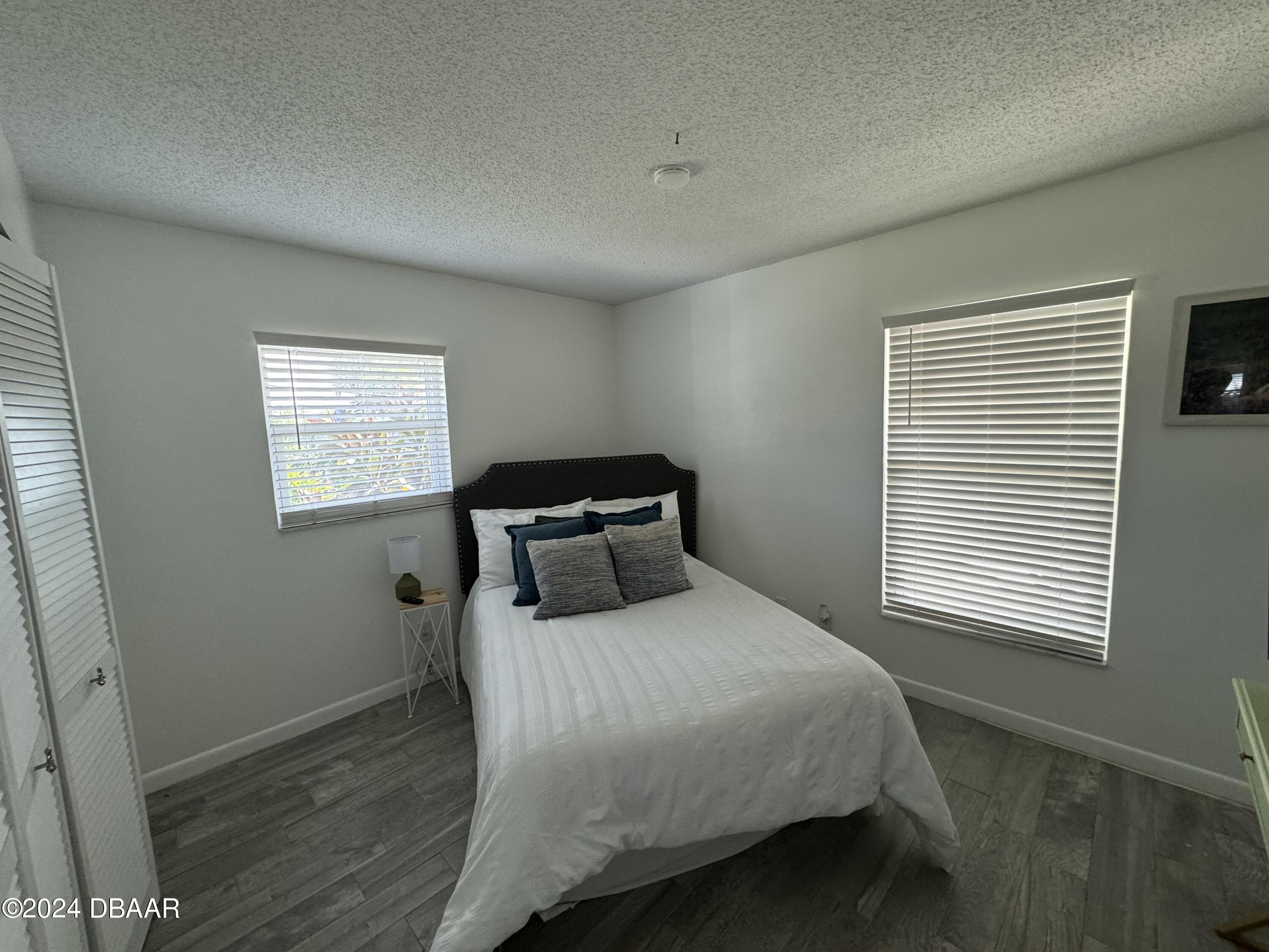 12 Ocean Crest Drive Ormond Beach, FL 32176 - Photo 28 of 31 a bedroom with a bed and a window