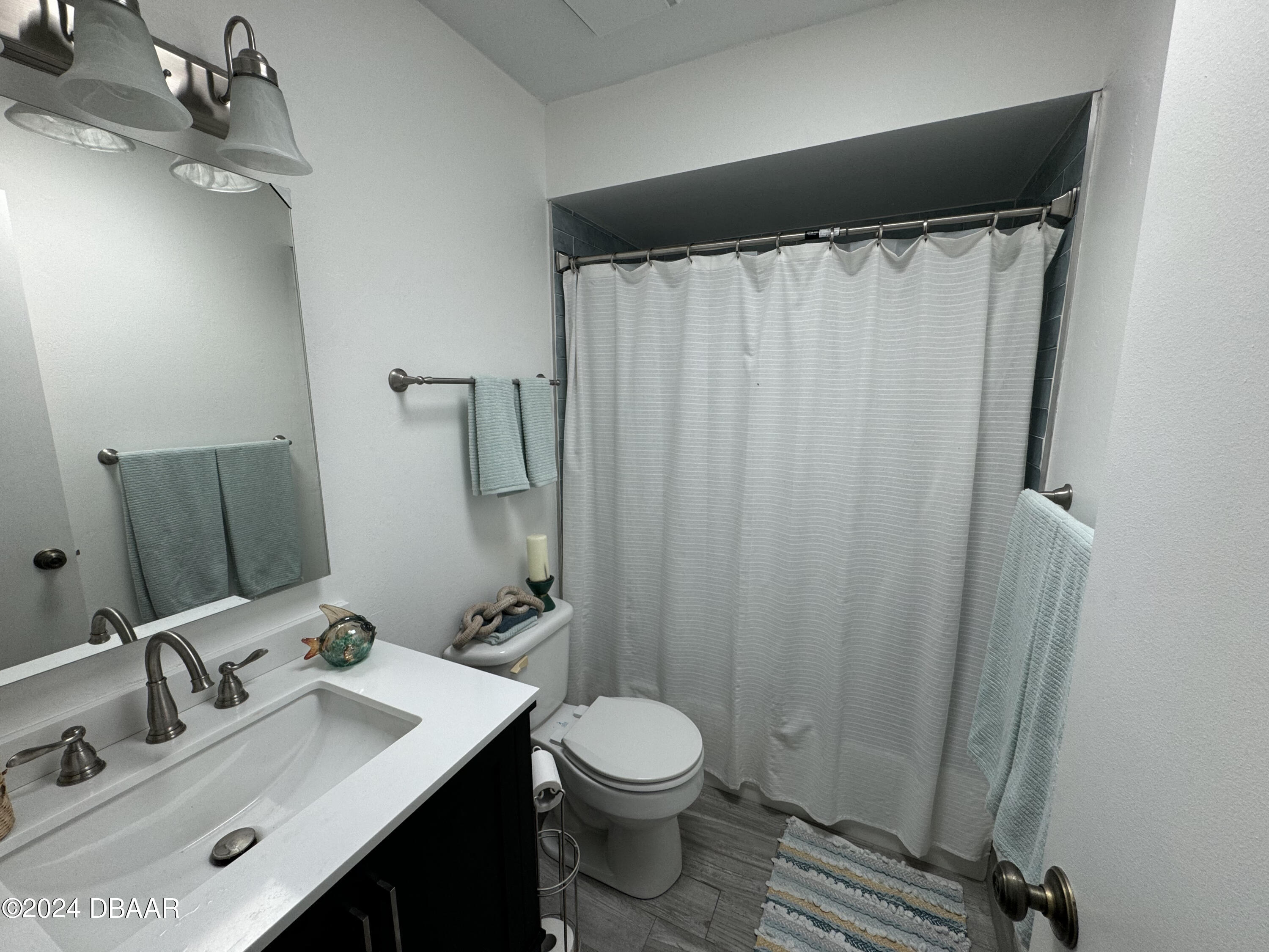 12 Ocean Crest Drive Ormond Beach, FL 32176 - Photo 29 of 31 a bathroom with a sink toilet and shower