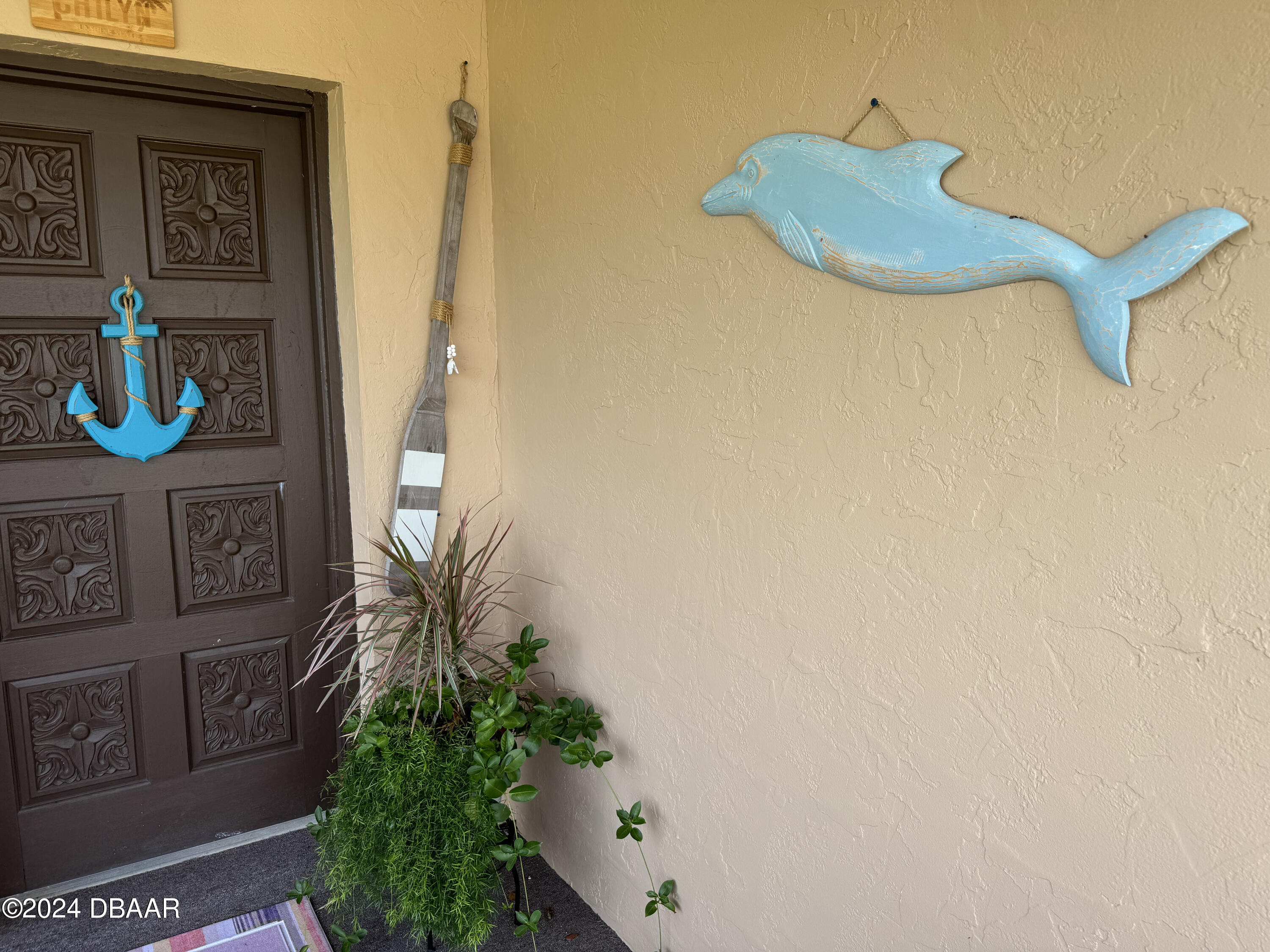 12 Ocean Crest Drive Ormond Beach, FL 32176 - Photo 3 of 31 a vase of flowers sitting on a table