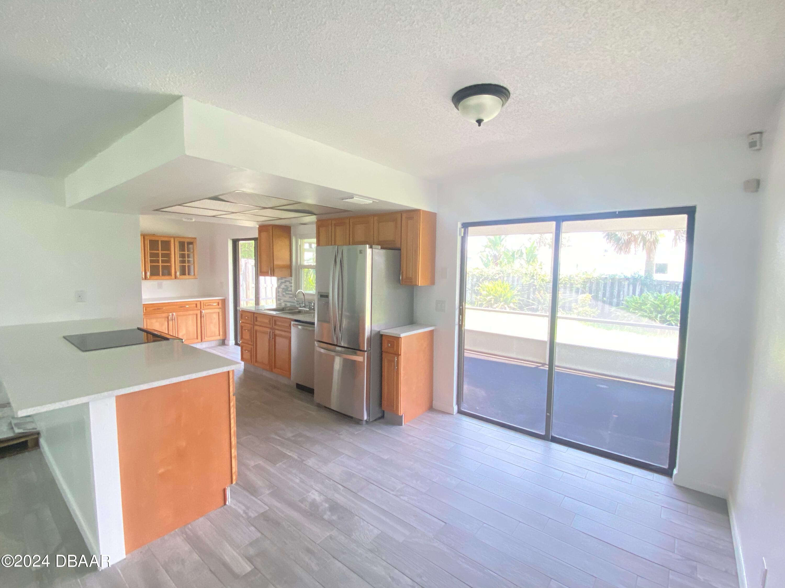 12 Ocean Crest Drive Ormond Beach, FL 32176 - Photo 5 of 31 a view of an empty room with a window
