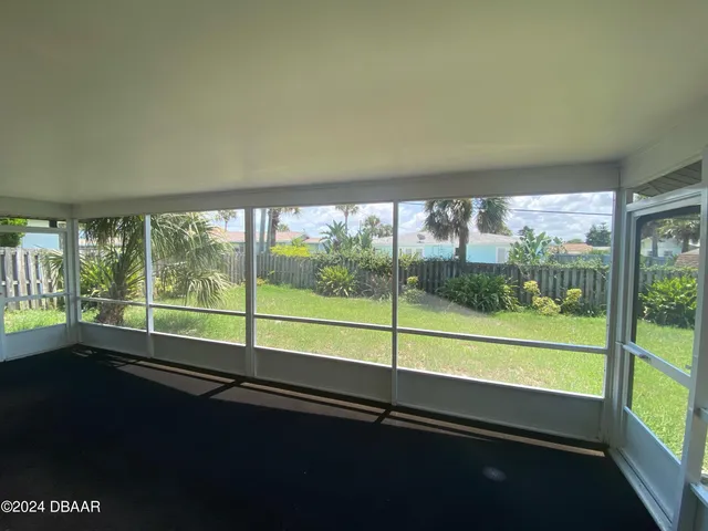 a view of a room with window and an outdoor view