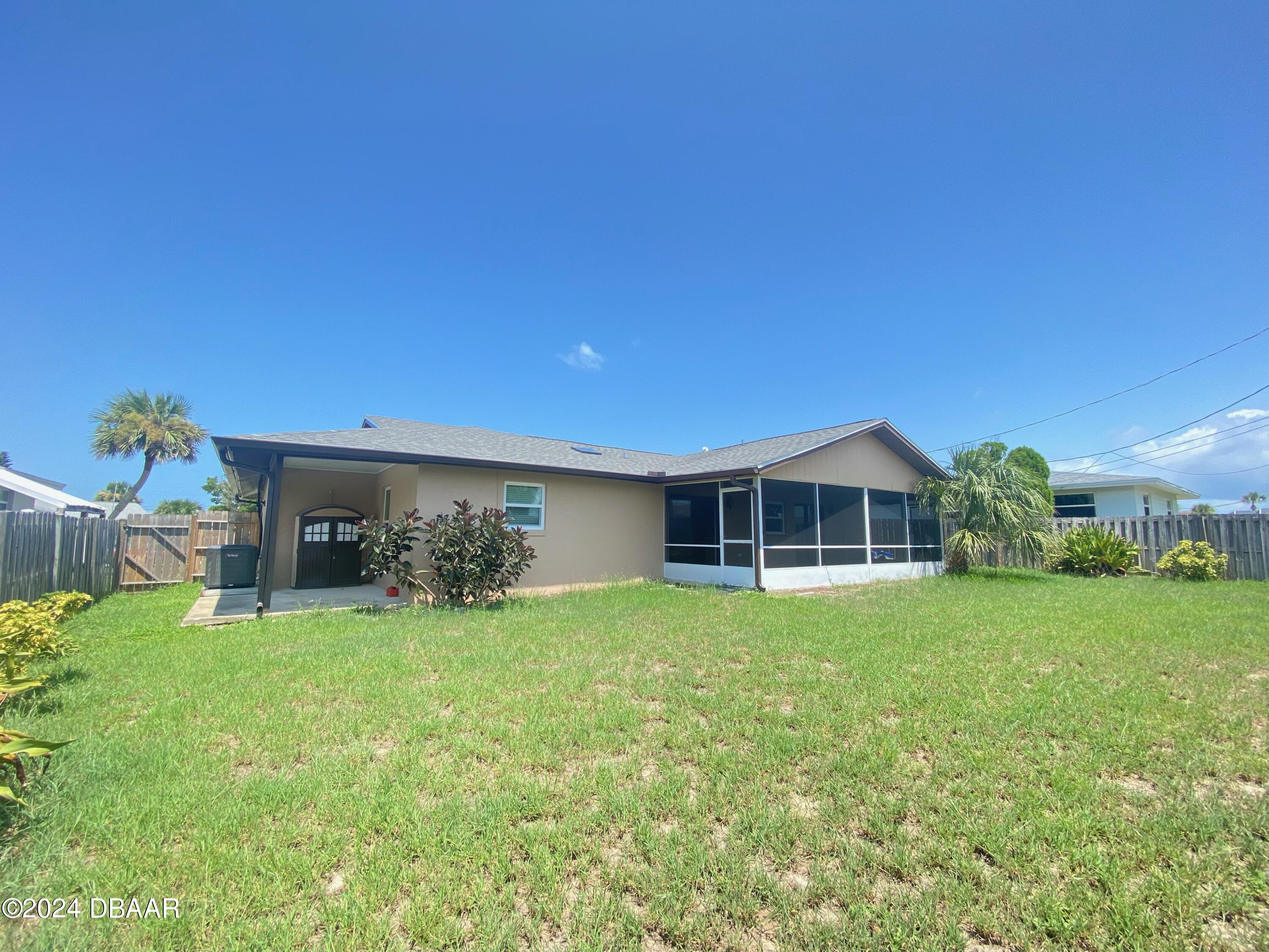 12 Ocean Crest Drive Ormond Beach, FL 32176 - Photo 10 of 31 a view of a house with a yard