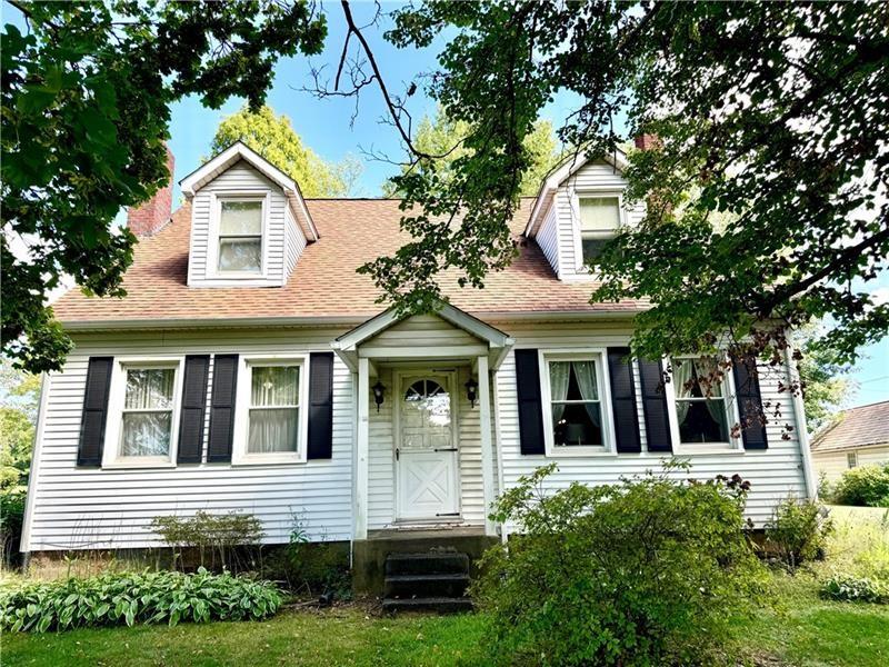 149 South Franklin Street Prospect, PA 16052 - Photo 1 of 25 a view of a brick house with large windows and a large tree