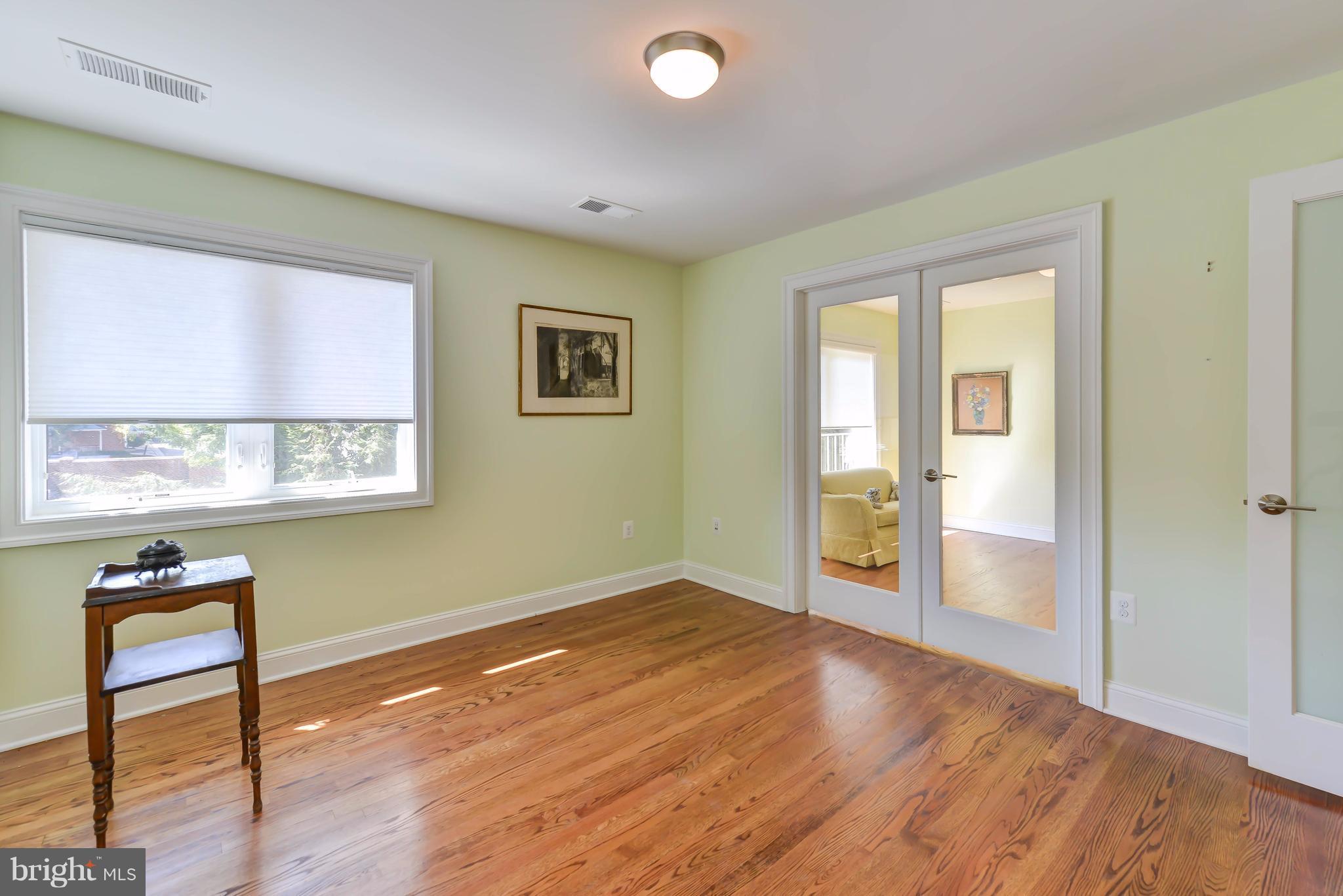 2126 Military Road Arlington, VA 22207 - Photo 26 of 29 a view of a big room with wooden floor and windows