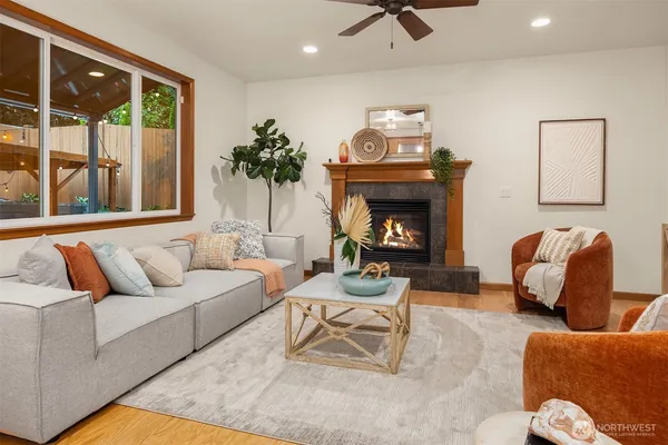 a living room with furniture and a fireplace
