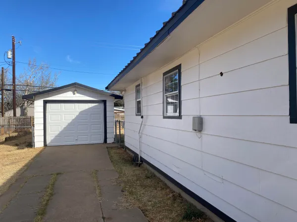 a view of a house with a street