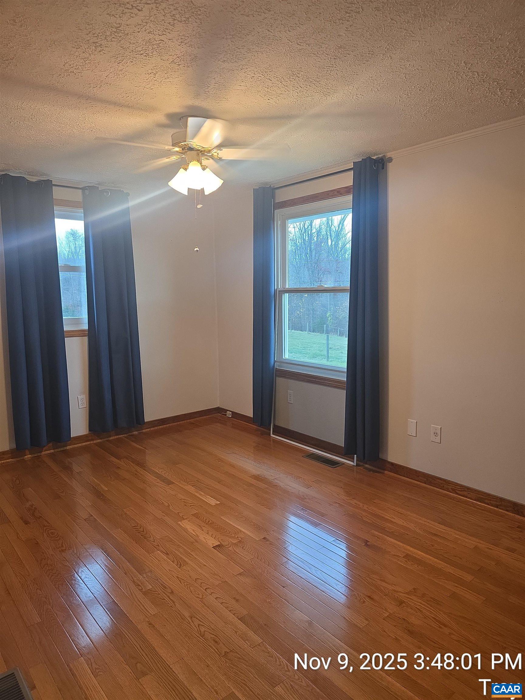 912 Hunters Lodge Road Troy, VA 22974 - Photo 14 of 22 a view of a room with wooden floor and a window