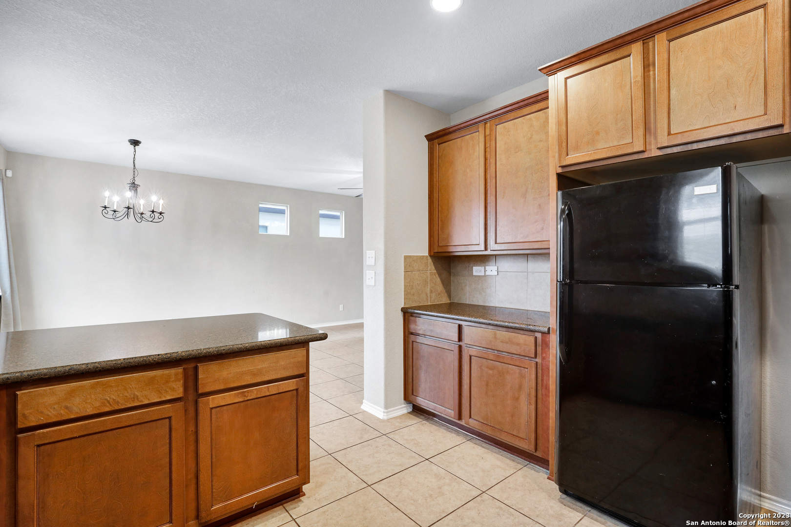 1331 Nicholas Manor San Antonio, TX 78258 - Photo 11 of 26 a kitchen with stainless steel appliances granite countertop a refrigerator a stove and a sink with cabinets