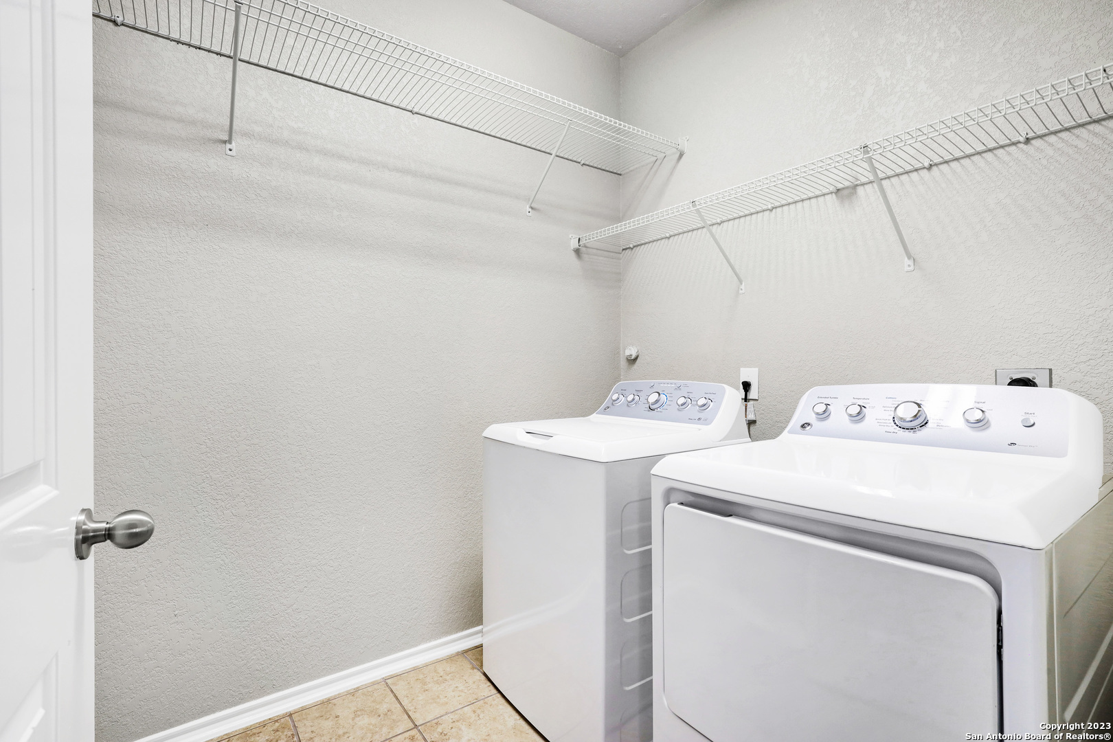 1331 Nicholas Manor San Antonio, TX 78258 - Photo 22 of 26 a utility room with dryer and washer