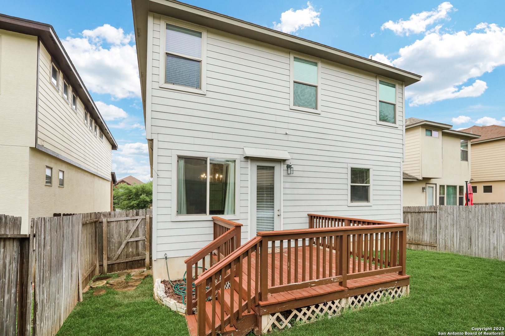 1331 Nicholas Manor San Antonio, TX 78258 - Photo 25 of 26 a view of a house with a wooden deck