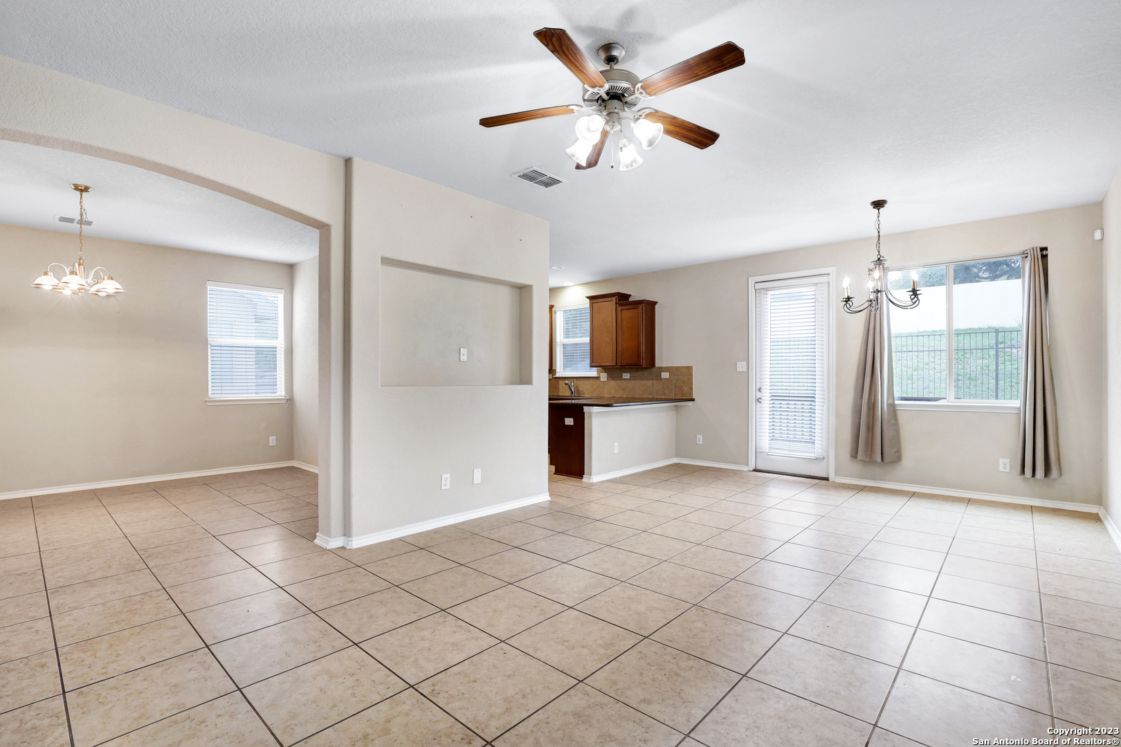 1331 Nicholas Manor San Antonio, TX 78258 - Photo 5 of 26 a view of a kitchen with a sink and a refrigerator