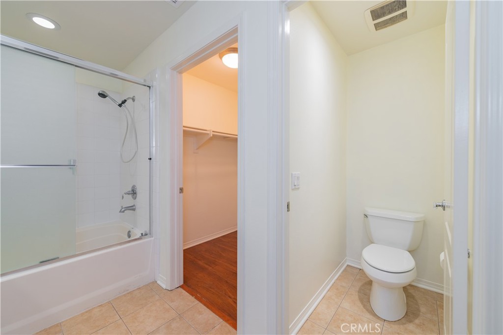 105 Hallmark Irvine, CA 92620 - Photo 12 of 32 a bathroom with a toilet and a shower