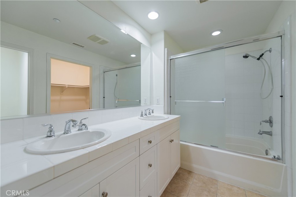 105 Hallmark Irvine, CA 92620 - Photo 13 of 32 a bathroom with a sink double vanity granite tub and shower