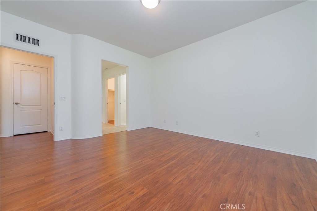 105 Hallmark Irvine, CA 92620 - Photo 14 of 32 a view of an empty room with wooden floor and a window