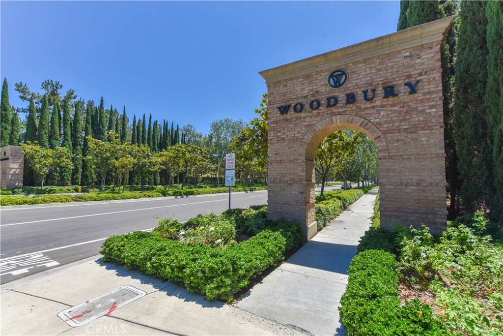 105 Hallmark Irvine, CA 92620 - Photo 16 of 32 a front view of a house with a yard and a garden