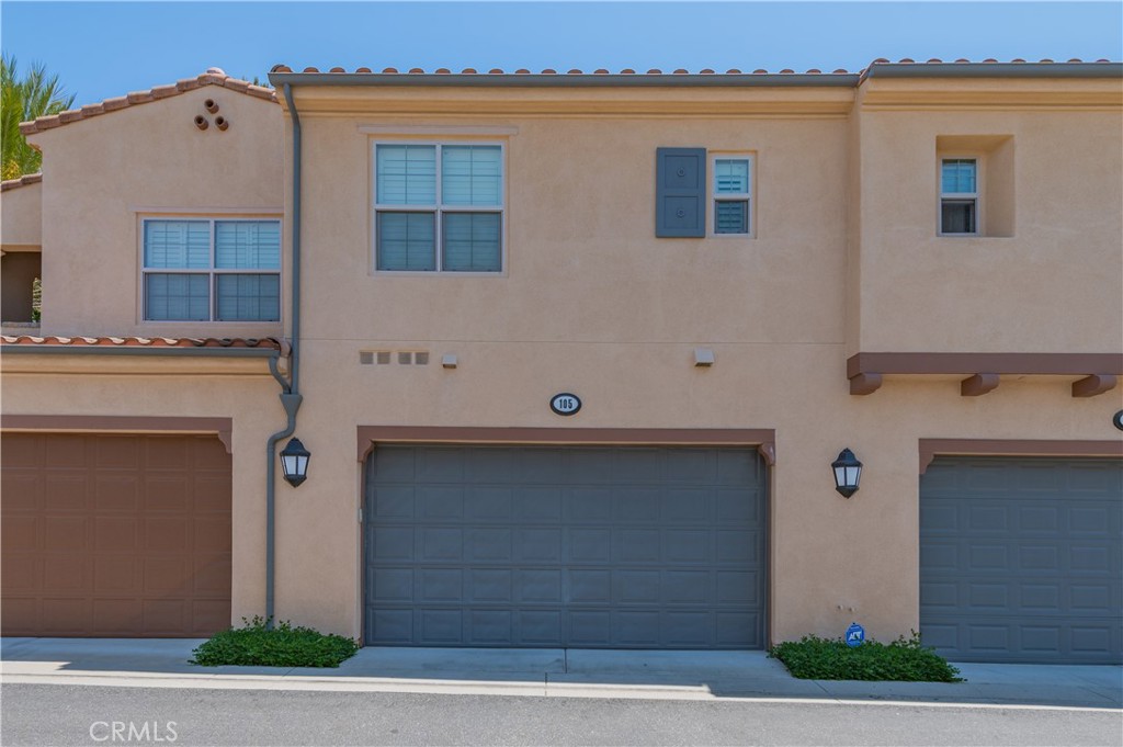 105 Hallmark Irvine, CA 92620 - Photo 3 of 32 a front view of a house with garage