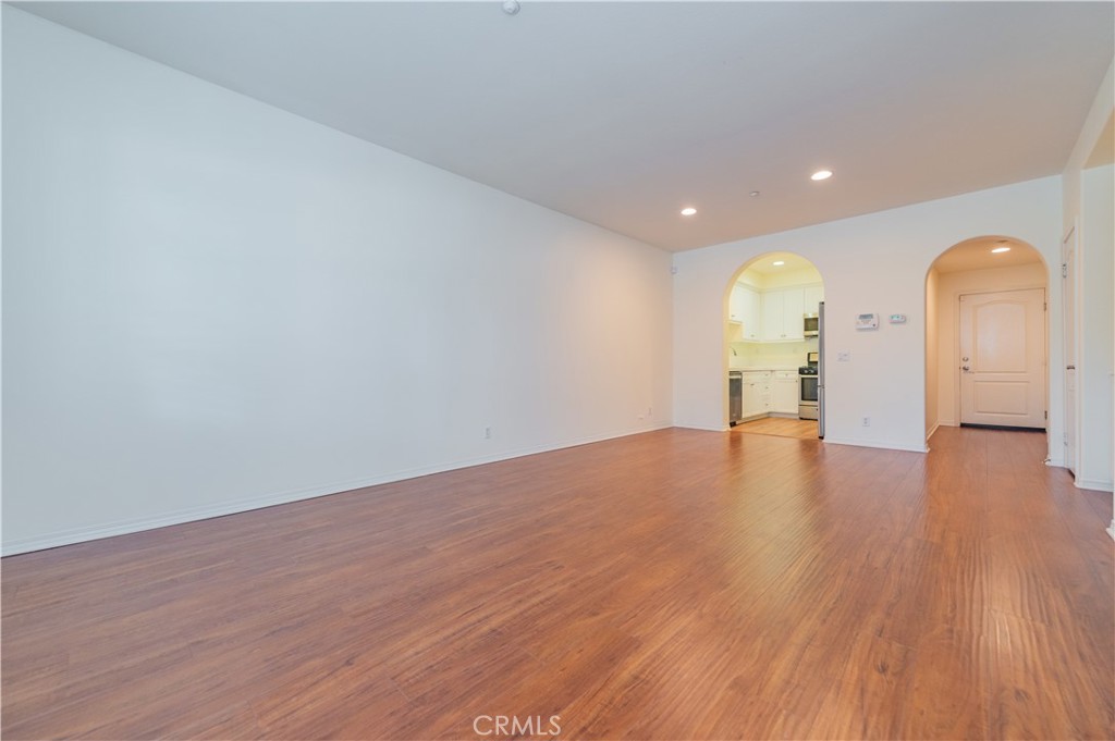 105 Hallmark Irvine, CA 92620 - Photo 4 of 32 a view of empty room with wooden floor and window