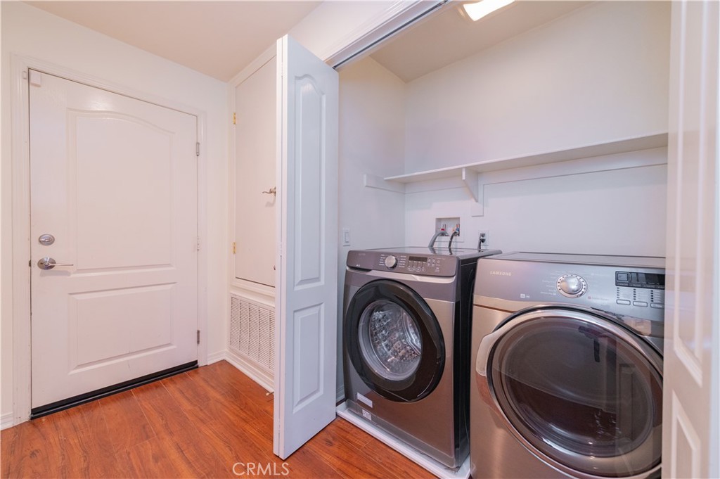 105 Hallmark Irvine, CA 92620 - Photo 9 of 32 a view of storage and utility room with washer and dryer