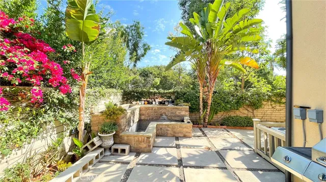 a view of backyard with patio