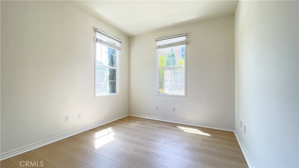 21 Vine Irvine, CA 92620 - Photo 17 of 37 an empty room with wooden floor and windows
