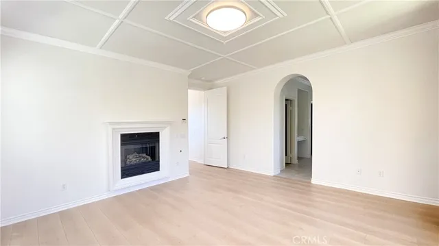 a bathroom with a tub a sink and a large mirror