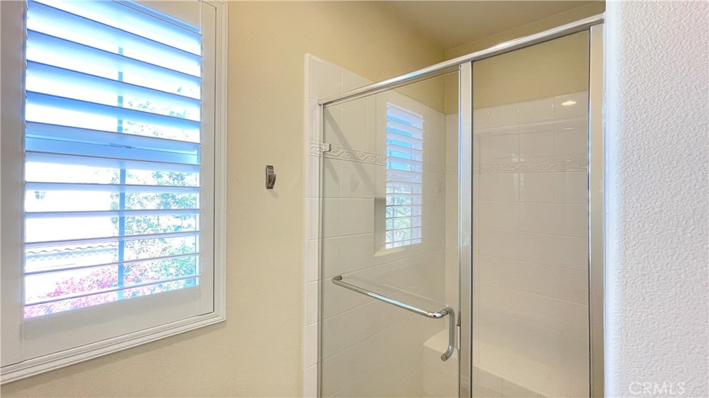 21 Vine Irvine, CA 92620 - Photo 26 of 37 a bathroom with a glass shower door